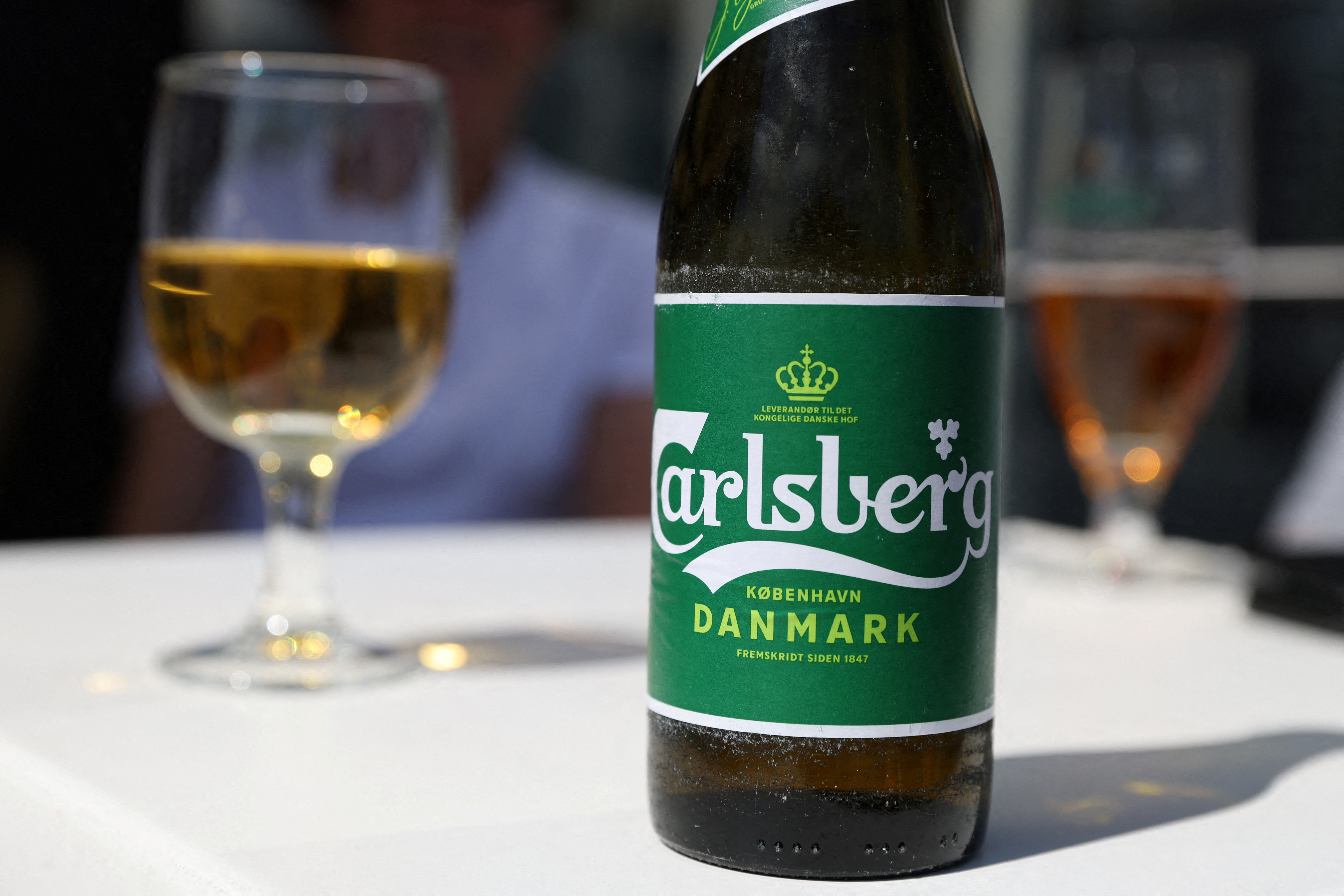 A Carlsberg beer sits on a table in a restaurant in Copenhagen