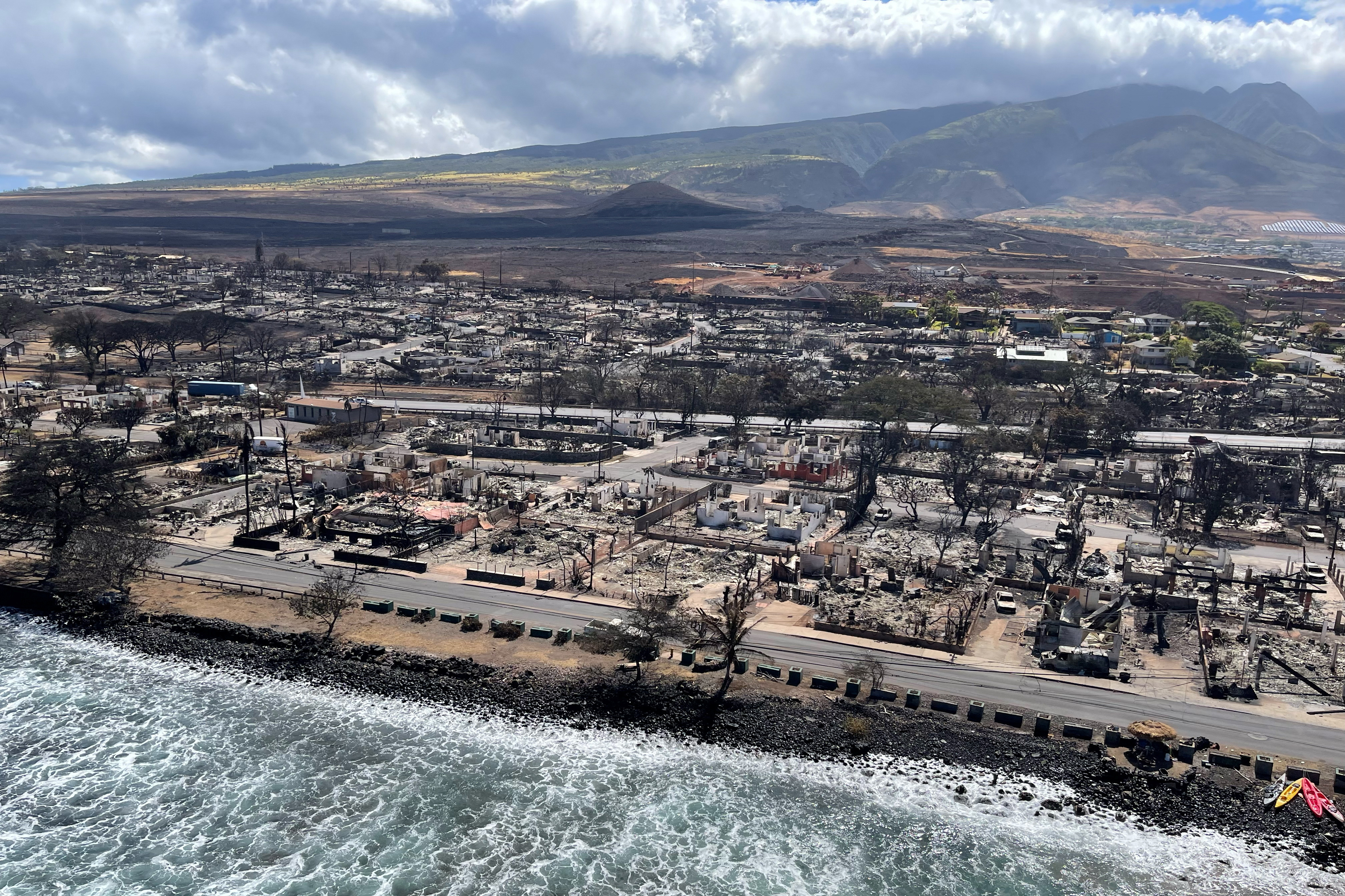 The shells of burned houses and buildings are left after wildfires in Lahaina