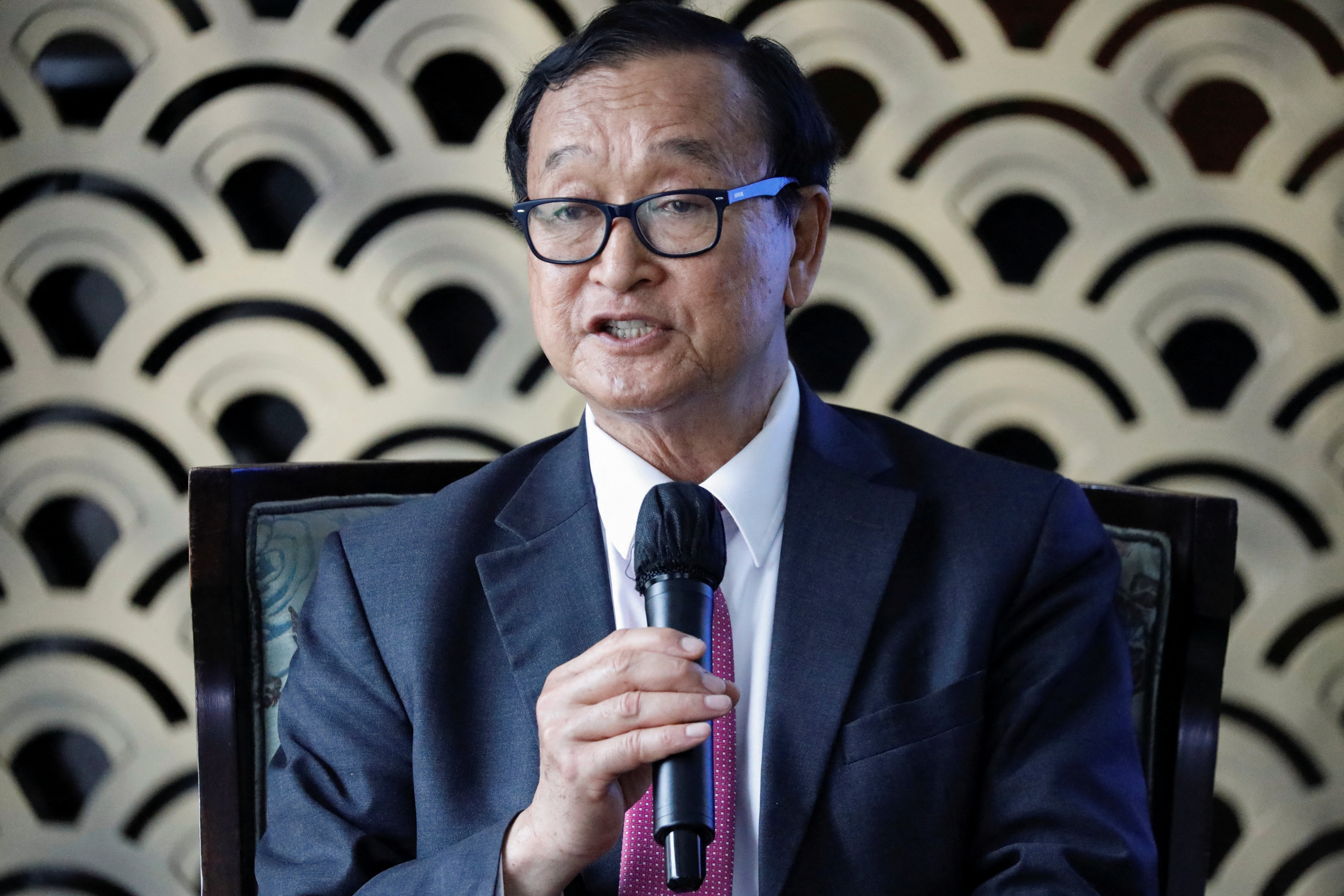 Cambodian opposition figure Sam Rainsy speaks during a press freedom event in Jakarta