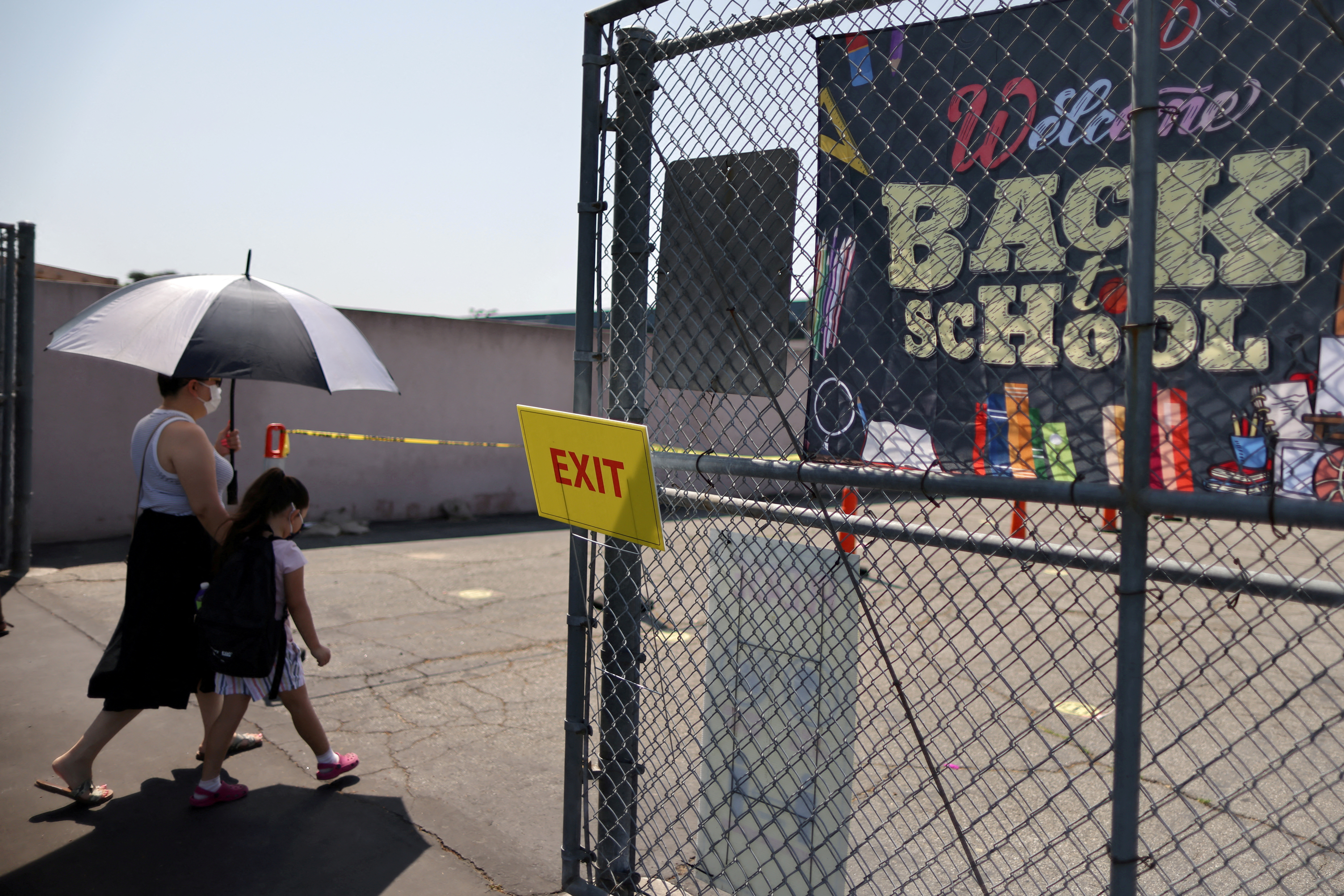 Sonia Vasquez, 39, and her daughter Angelique Sepulveda, 4, leave a back-to-school clinic for coronavirus disease (COVID-19) testing, vaccines, and free backpacks in South Gate, Los Angeles, California, U.S., August 12, 2021. REUTERS/Lucy Nicholson/File Photo