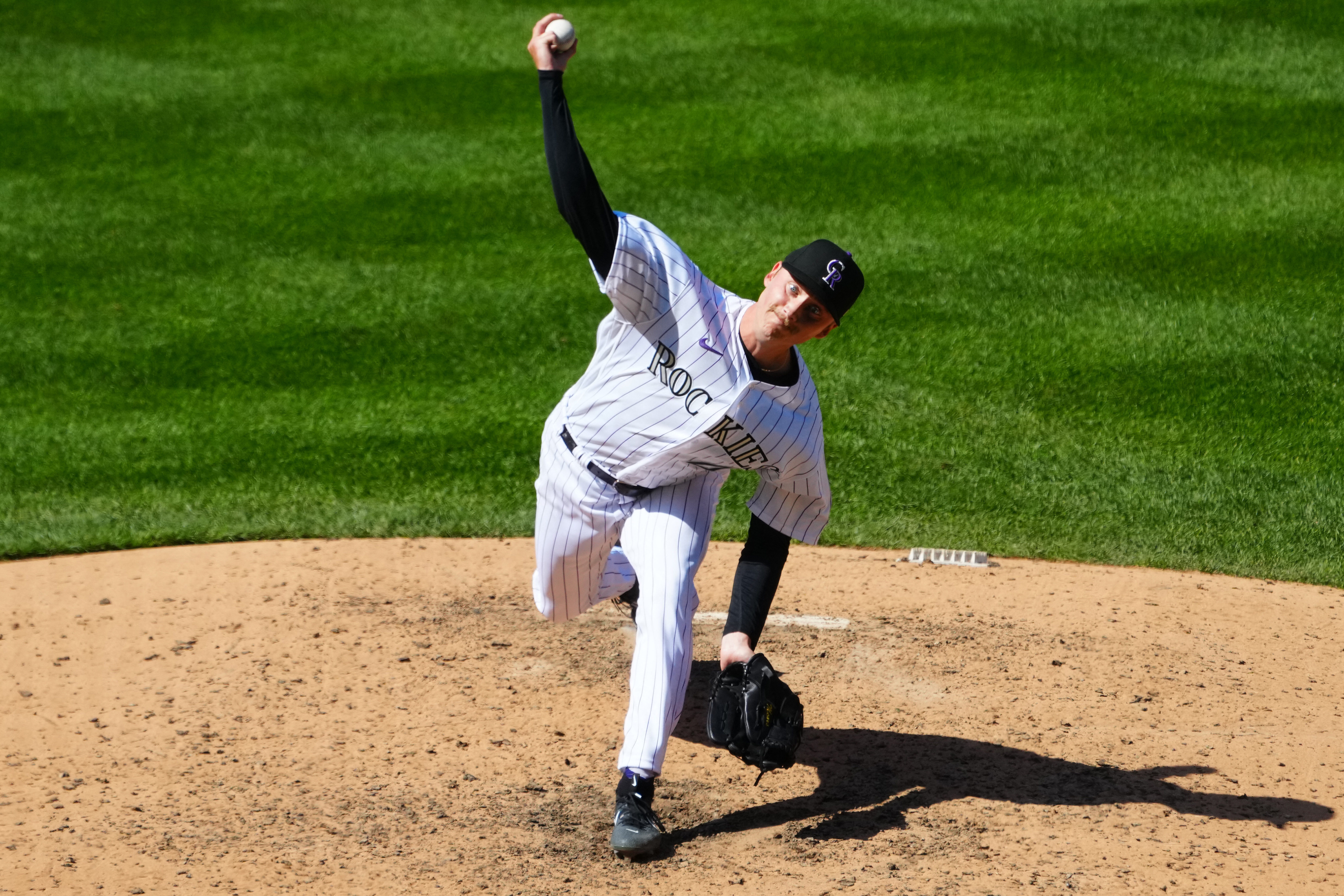 Rockies offense explodes in 12-4 win to avoid sweep