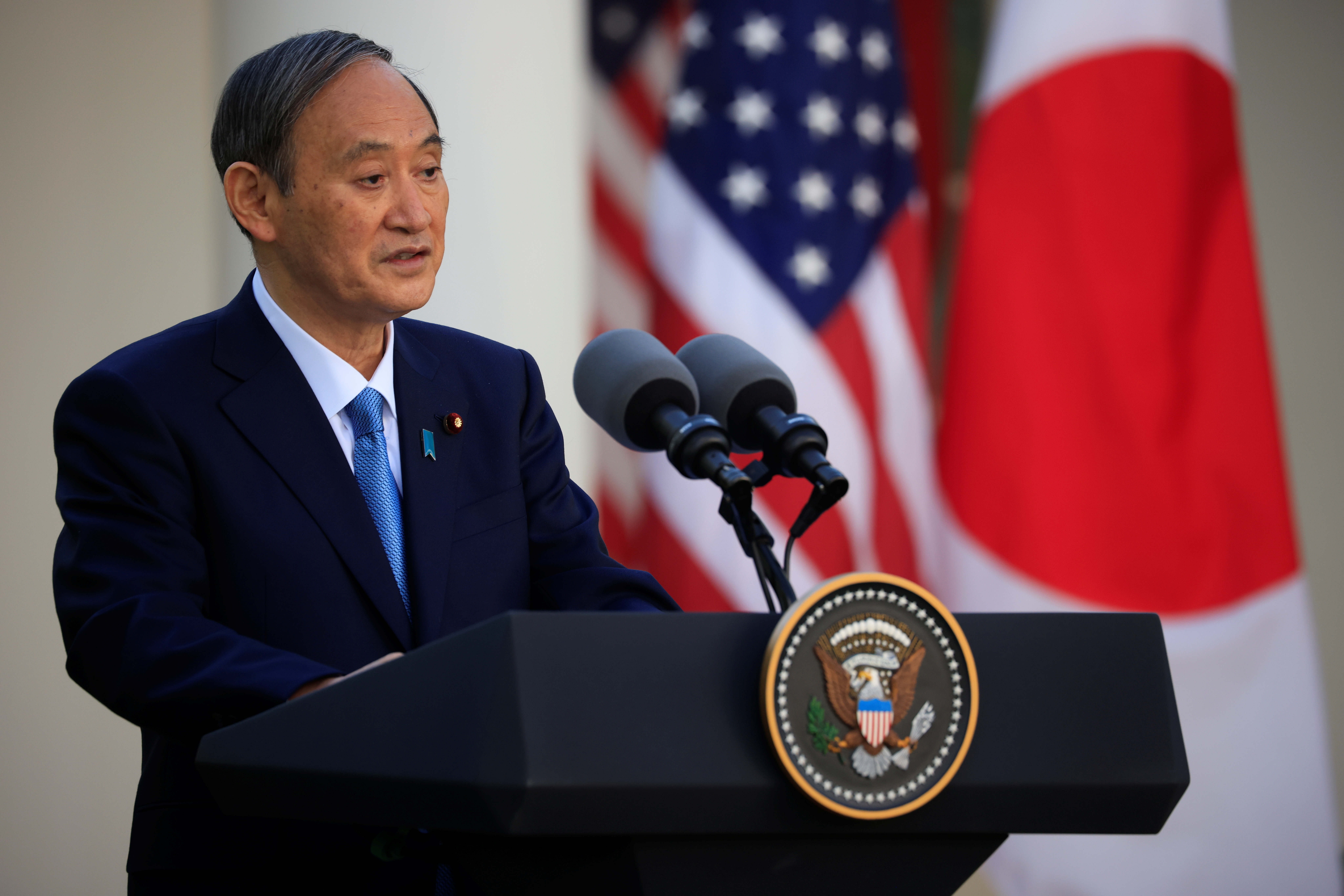 Japan's Prime Minister Yoshihide Suga addresses a joint news conference with U.S. President Joe Biden in the Rose Garden at the White House in Washington, U.S., April 16, 2021. REUTERS/Tom Brenner