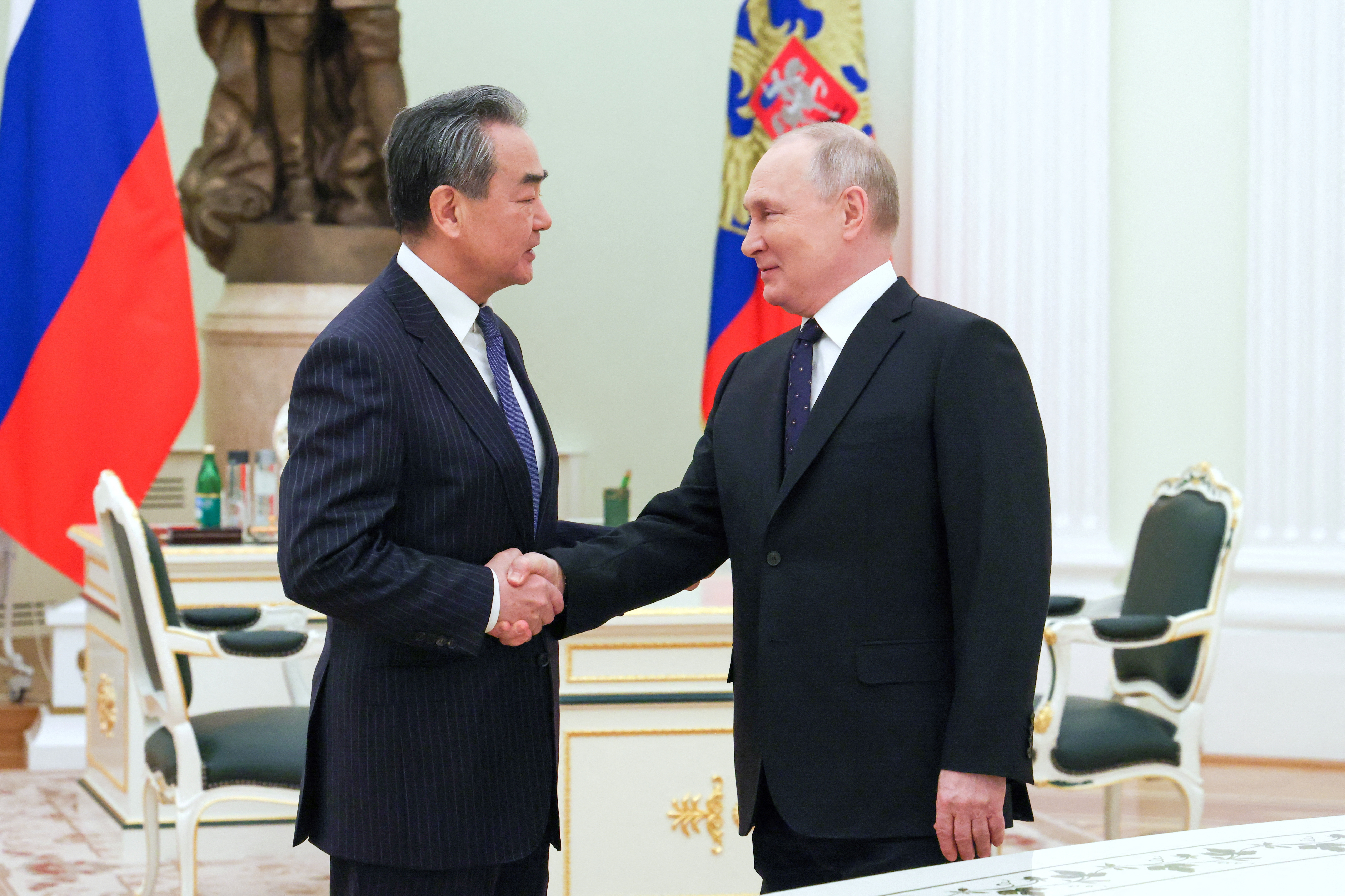 Russia's President Vladimir Putin meets with China's top diplomat Wang Yi in Moscow