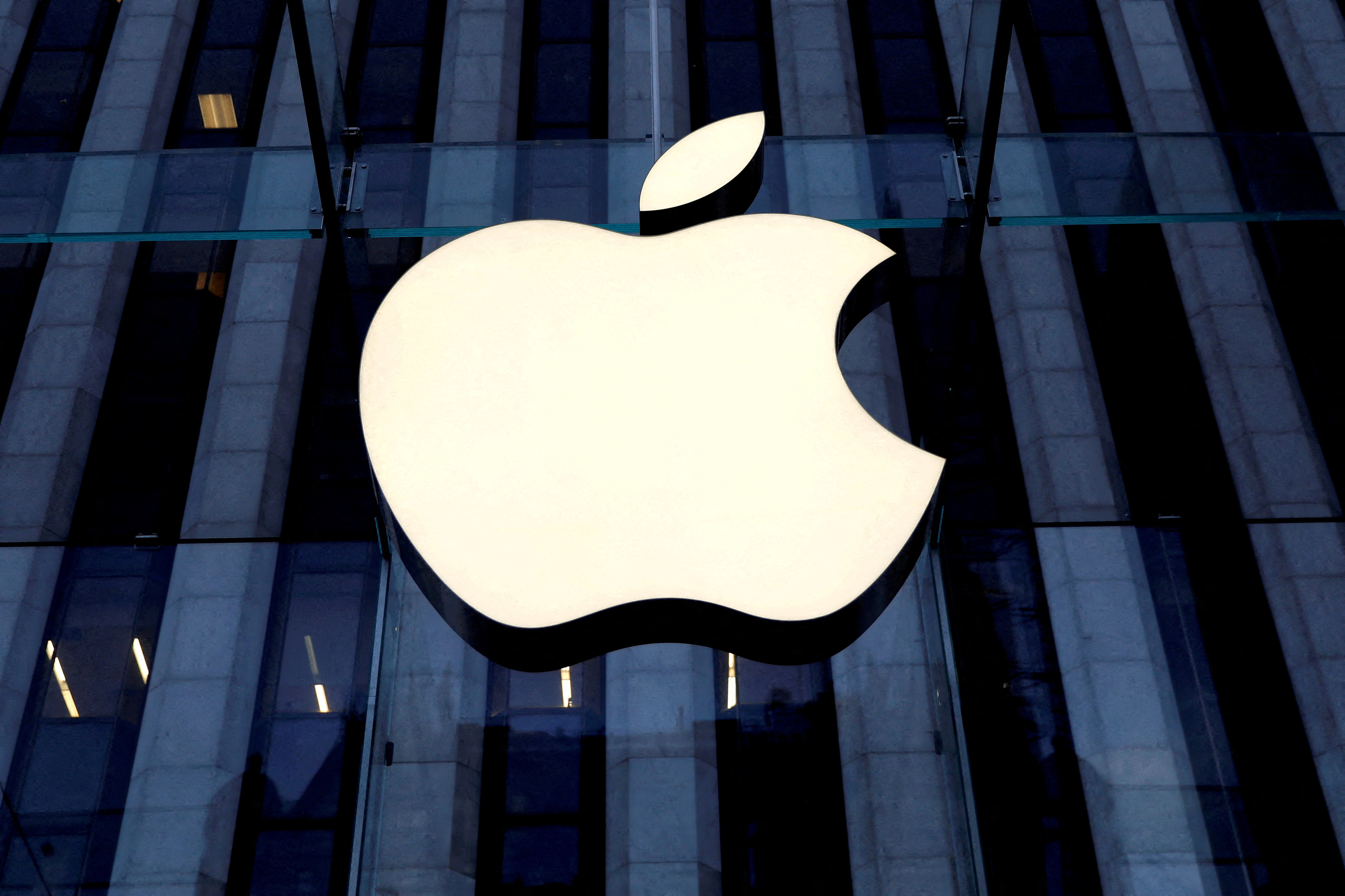 The Apple Inc. logo is seen hanging at the entrance to the Apple store on 5th Avenue in Manhattan, New York, U.S., October 16, 2019. REUTERS/Mike Segar/