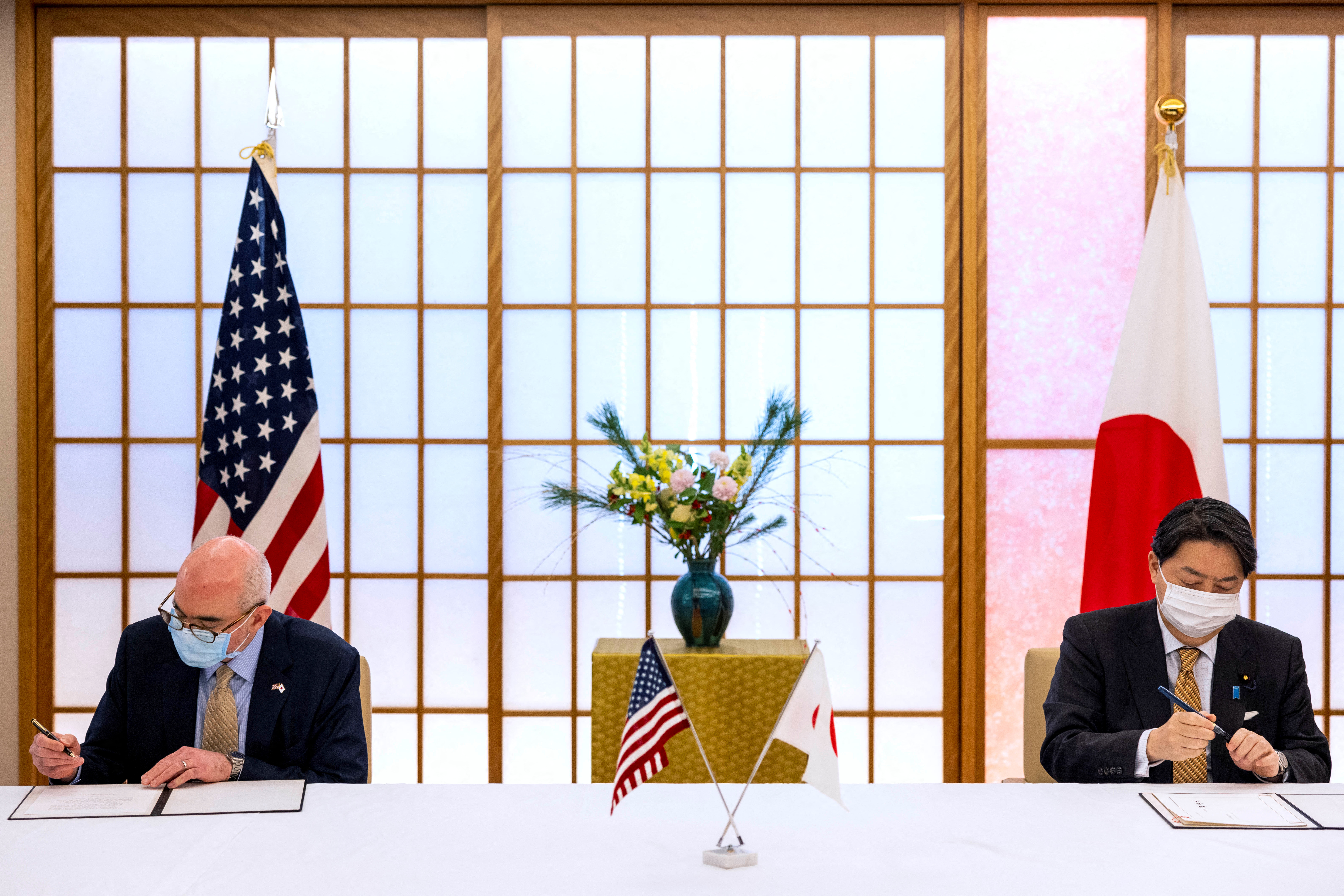 Japan's Foreign Minister Yoshimasa Hayashi and Raymond F. Greene, charge d'affairs ad interim of the U.S. embassy in Japan sign the New Special Measures Agreement (SMA) and Japan-U.S. Joint Research in Tokyo