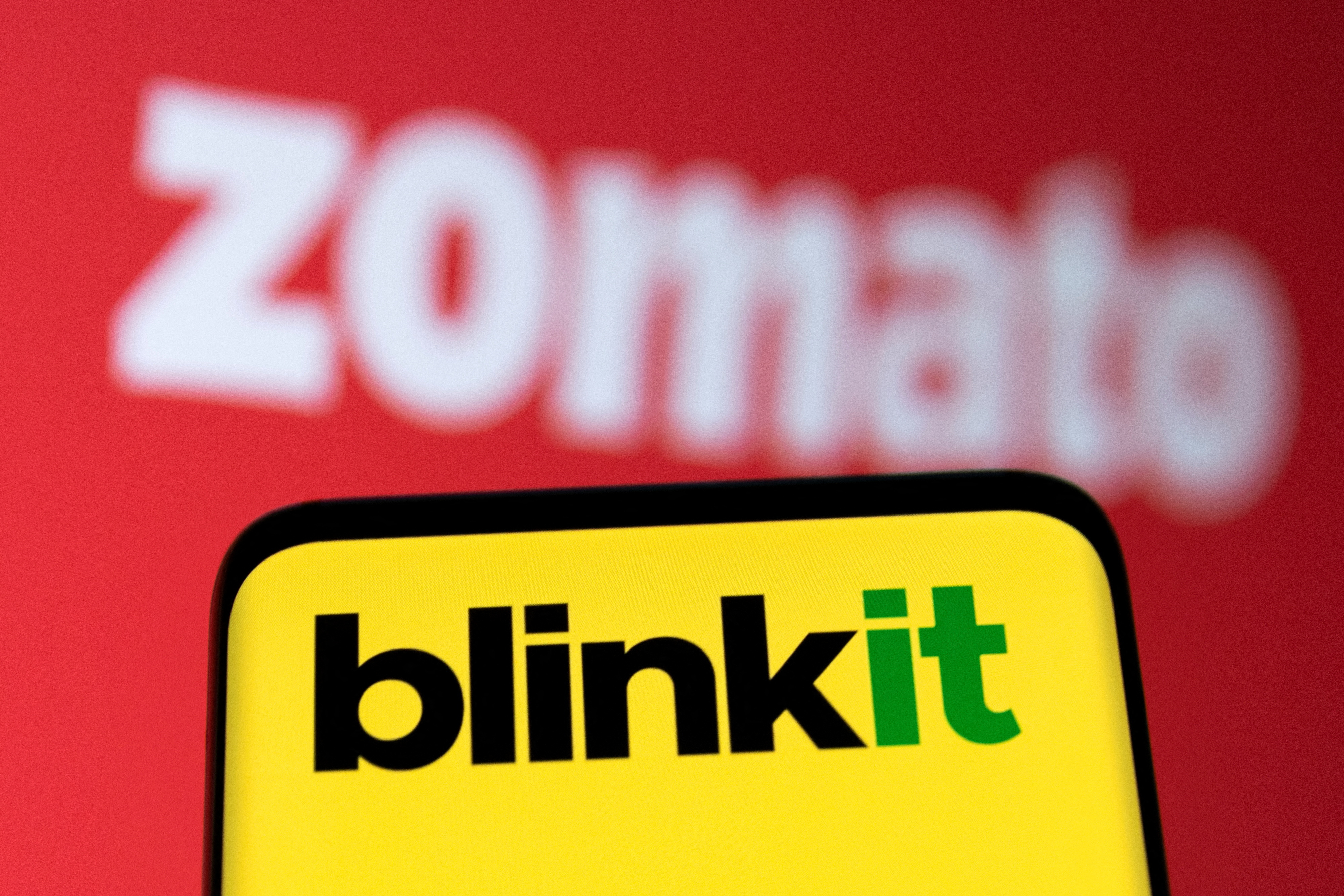 Illustration shows Zomato and Blinkit logos