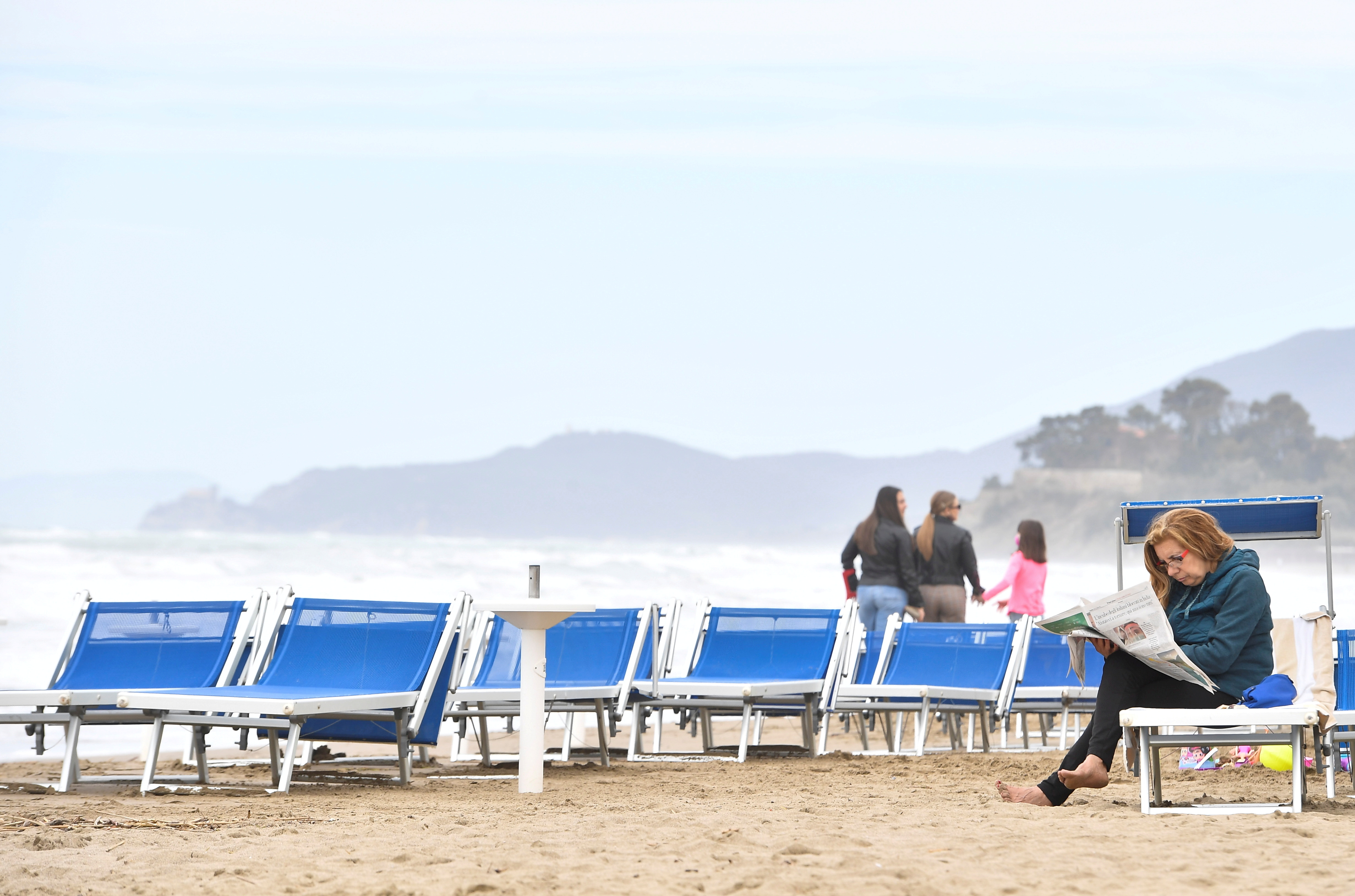 People enjoy a Sunday at the beach as coronavirus disease (COVID-19) restrictions ease around the country, in Castiglione della Pescaia, Italy, May 2, 2021. REUTERS/Jennifer Lorenzini/File Photo