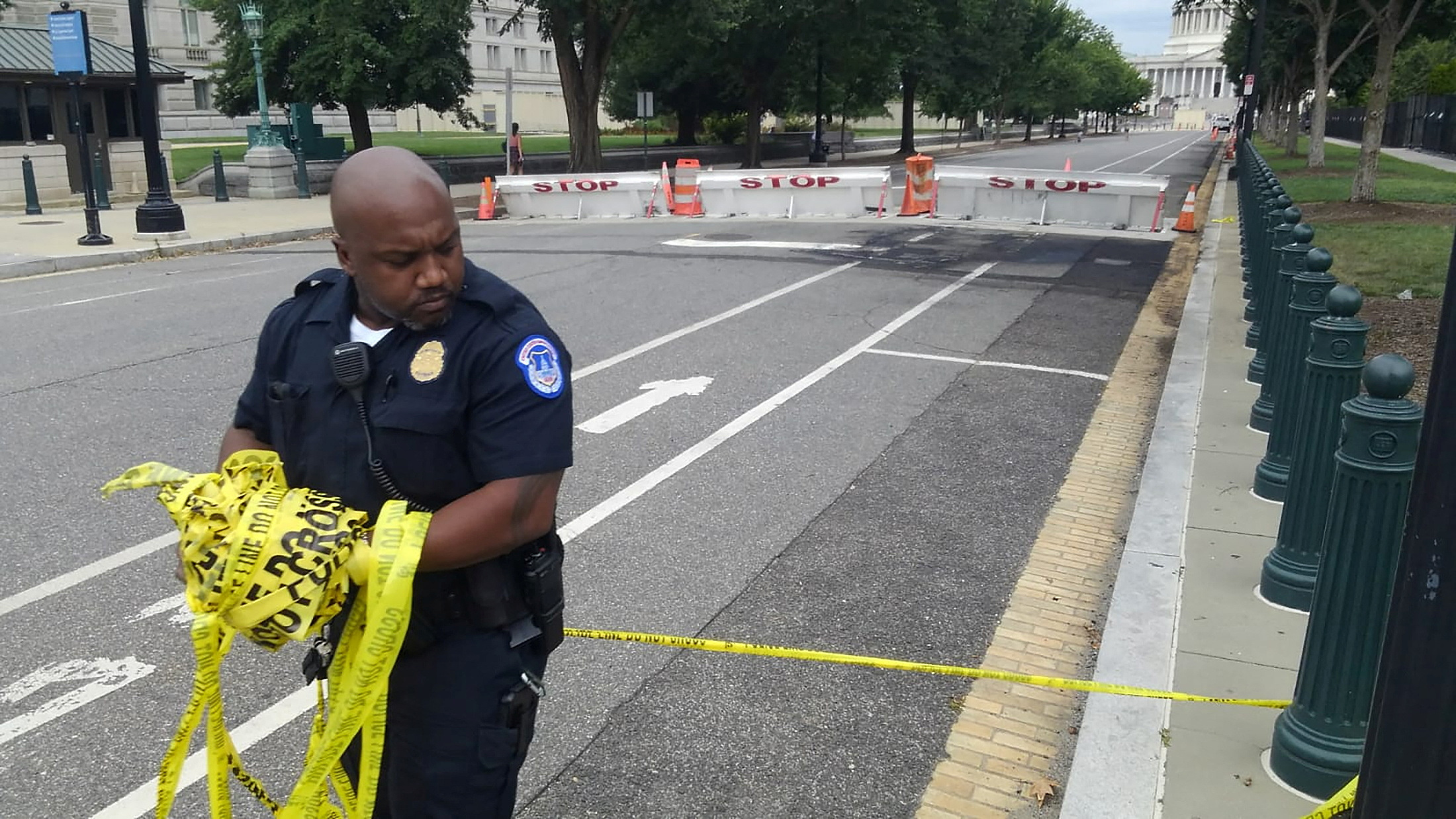 U.S. Capitol Police officer removes security tape in Washington