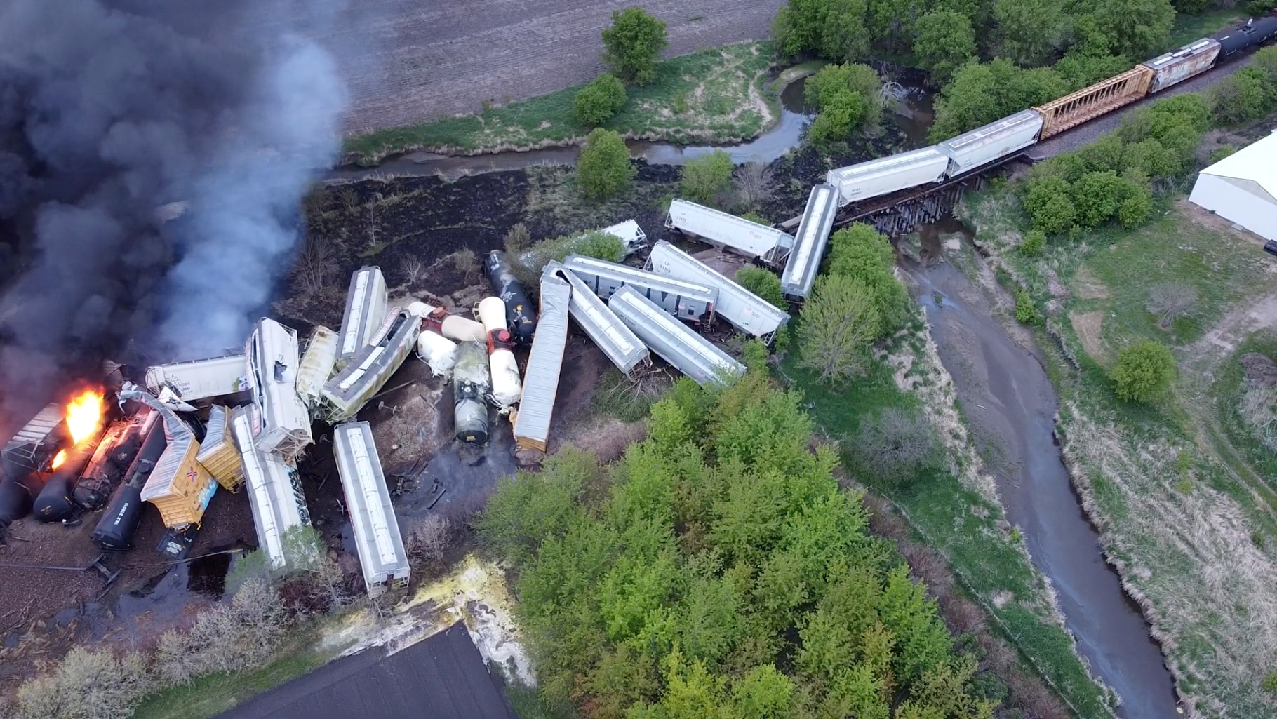 Fire is seen on a Union Pacific train carrying hazardous material that has derailed in Sibley, Iowa, U.S., in this still frame obtained from social media drone video dated May 16, 2021. NATHAN MINTEN/via REUTERS 