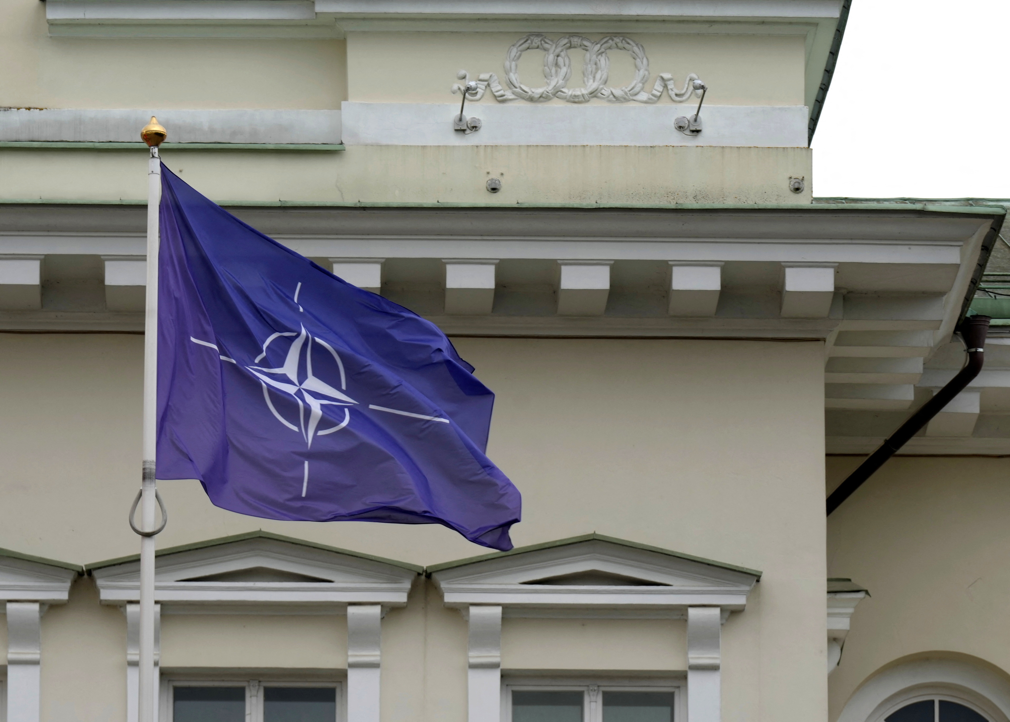 NATO flag flutters next to Presidential Palace in Vilnius