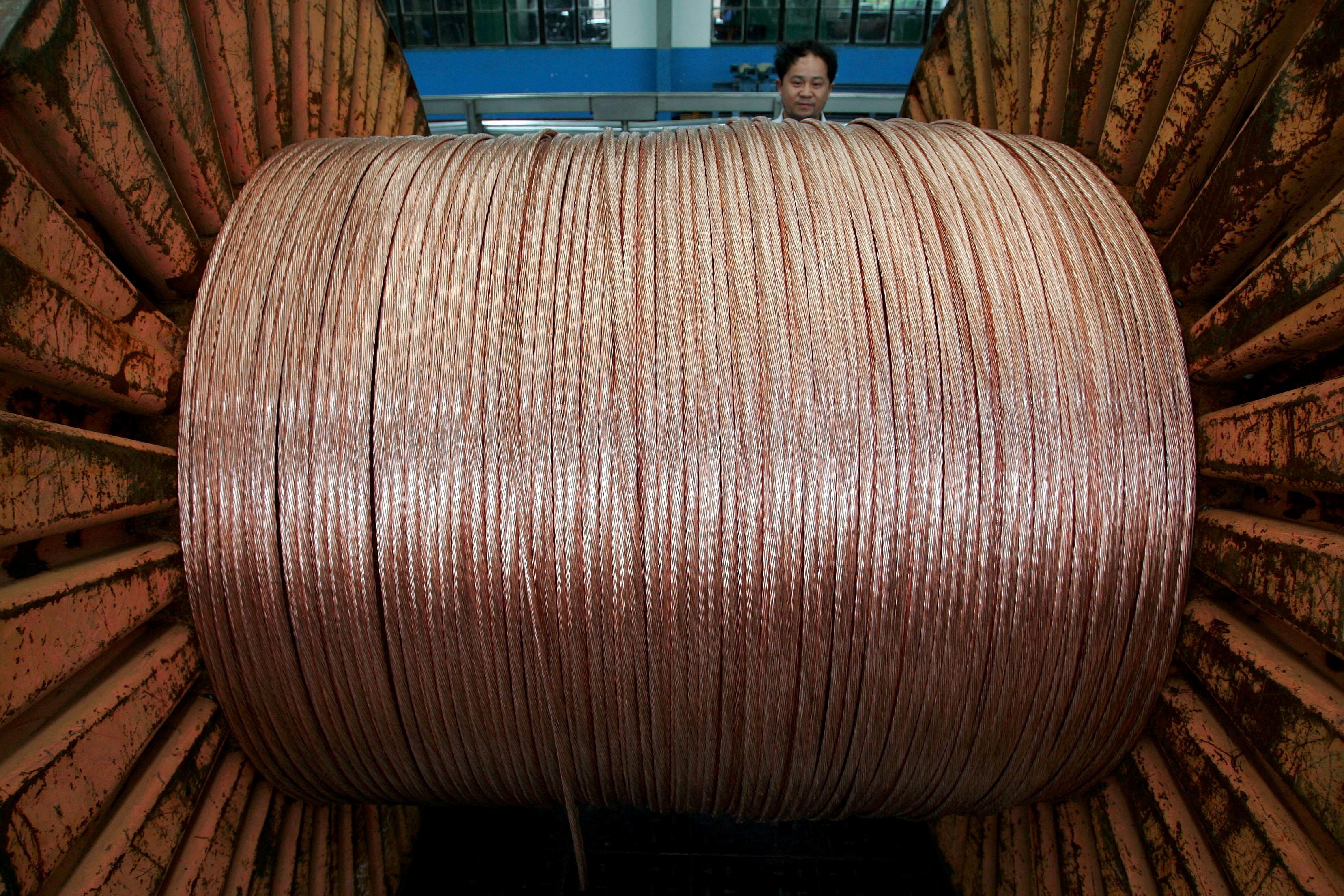 An employee works at an electricity cable factory in Baoying, Jiangsu province, China