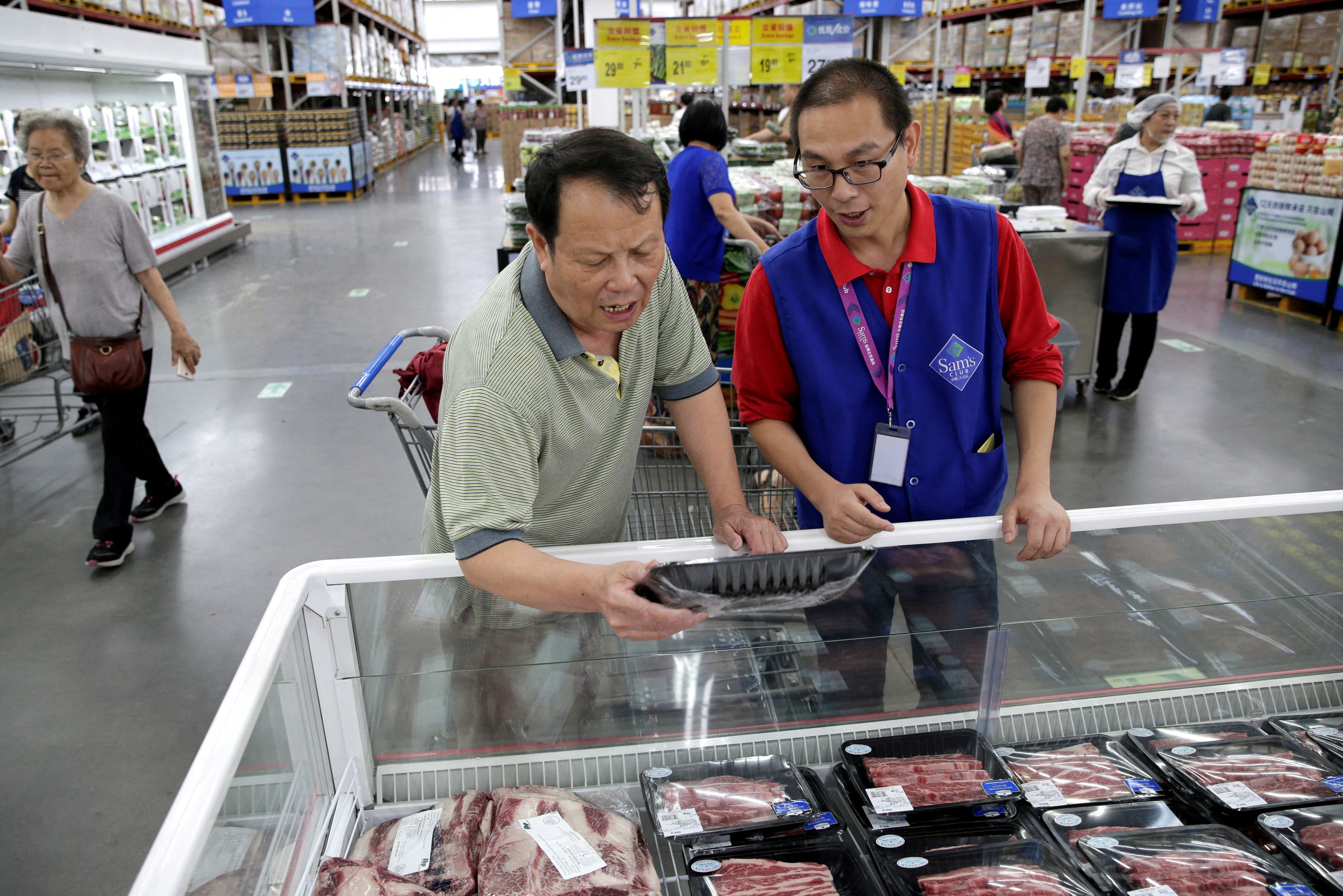 A customer checks the beef steaks at a Sam's Club store of Wal-Mart in Beijing, China June 29, 2017. REUTERS/Jason Lee