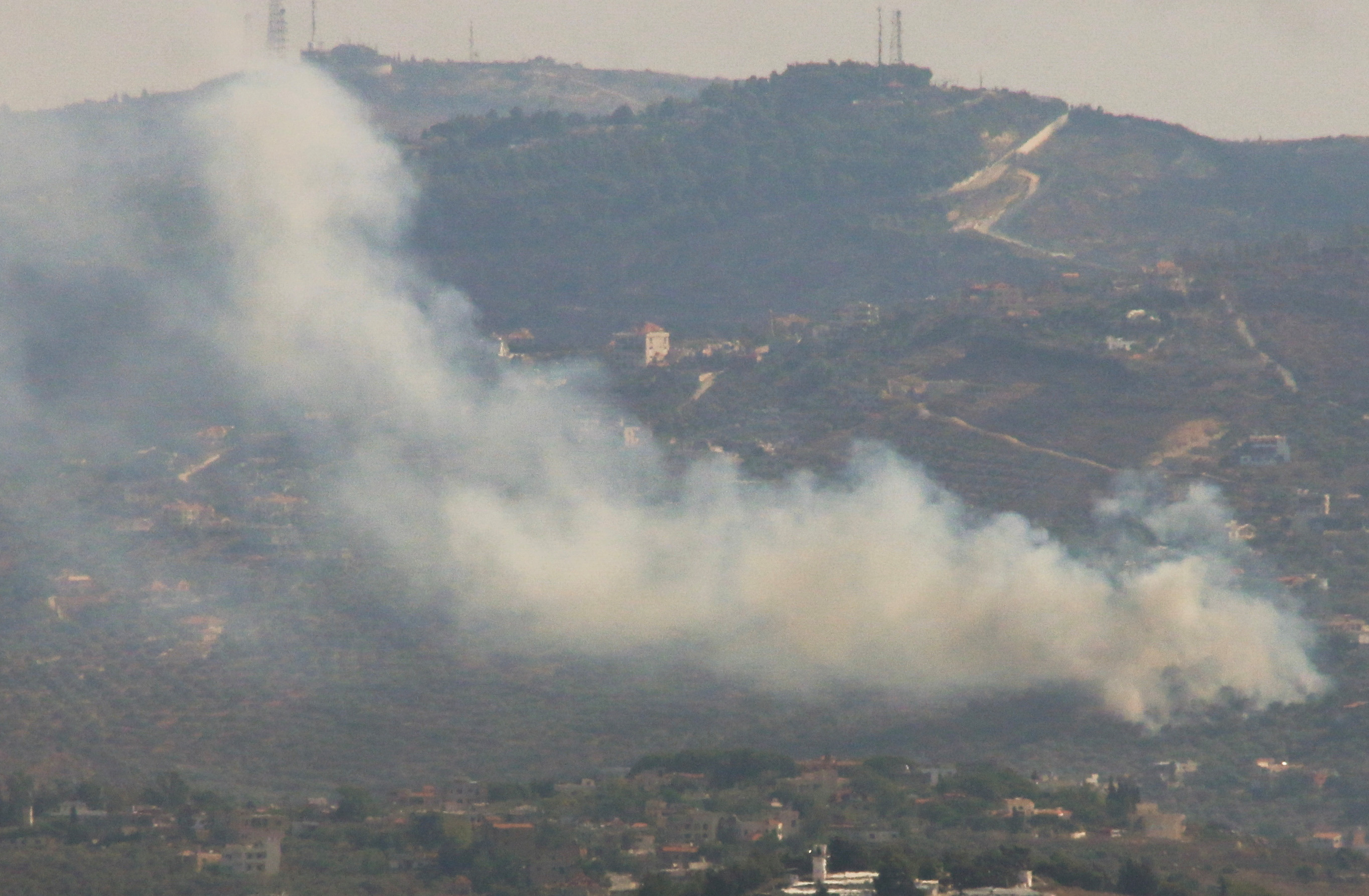 Smoke rises from Kfar Kila, amid cross-border hostilities between Hezbollah and Israeli forces, as pictured from Marjayoun, near the border with Israel