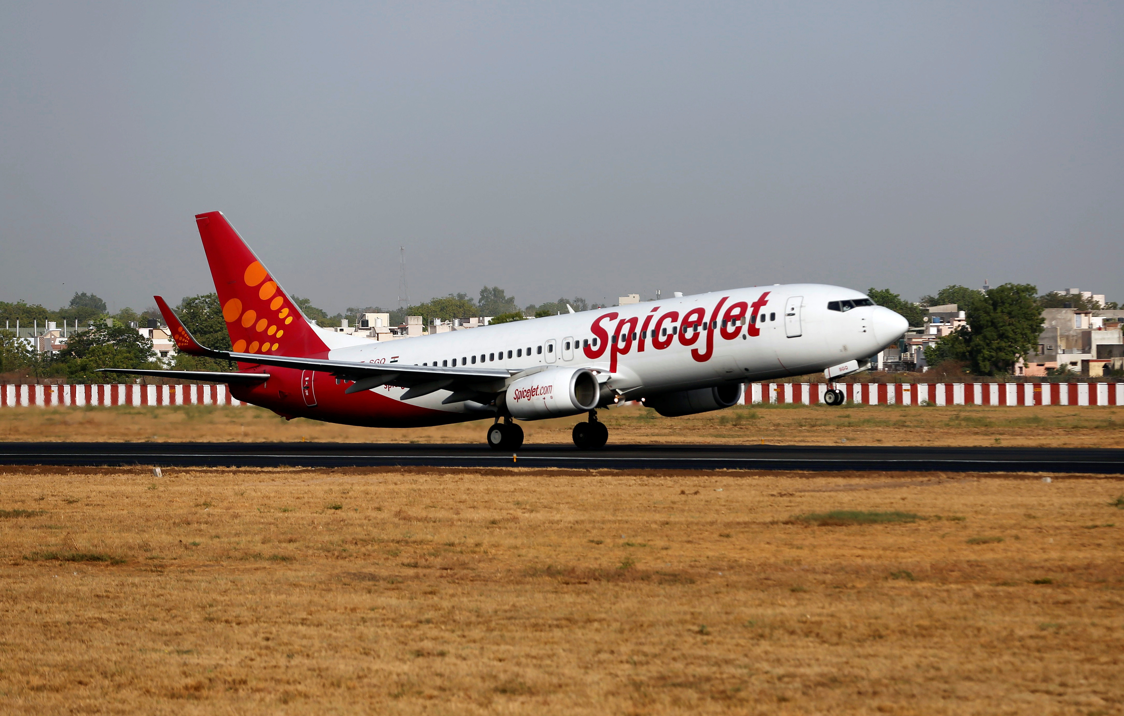 A SpiceJet Boeing 737 passenger aircraft takes off from Sardar Vallabhbhai Patel international airport in Ahmedabad