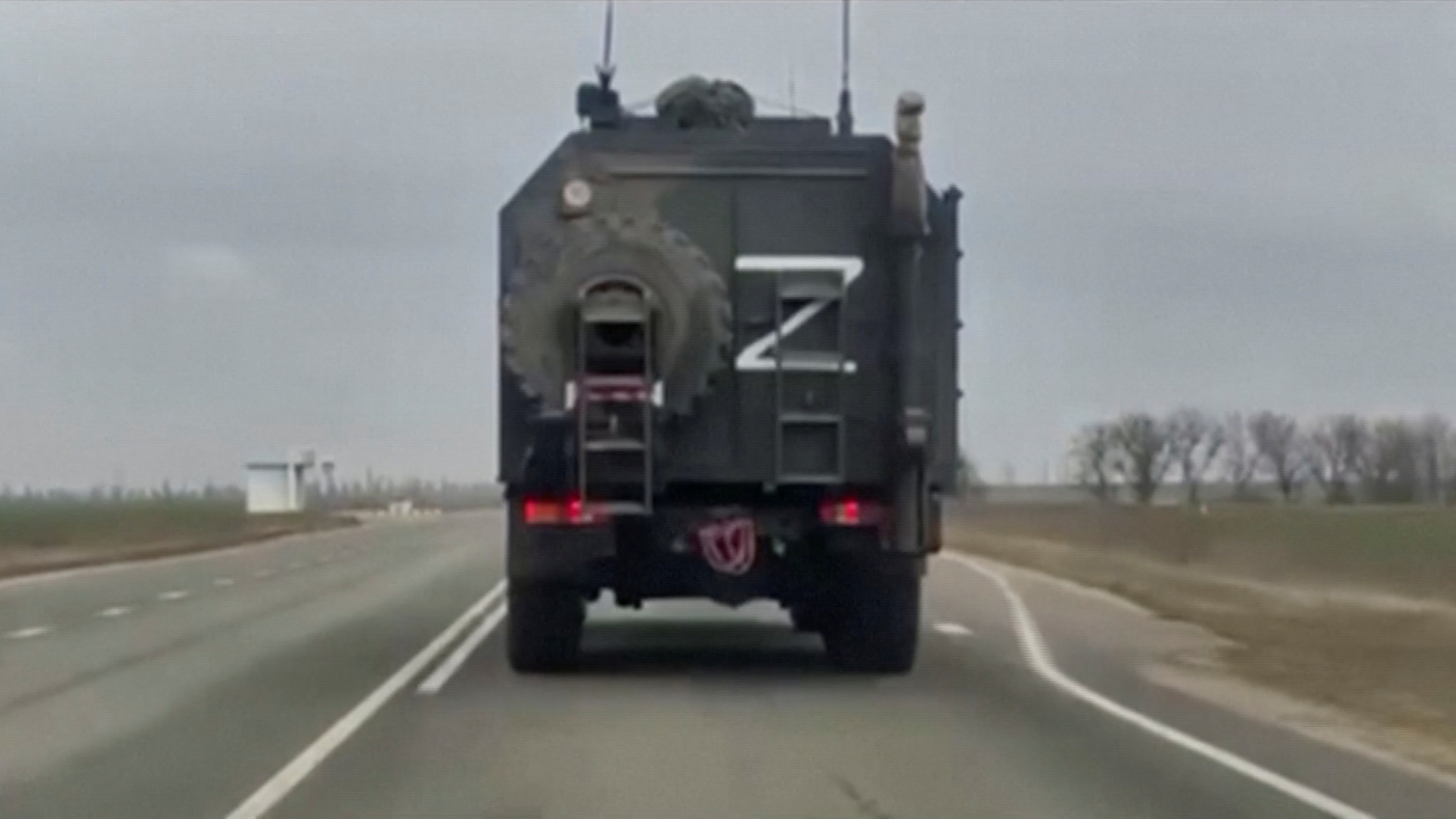 A military truck, with letter 'Z' on it, drives near Armyansk, in Crimea, February 24, 2022 in this screen grab taken from a video. REUTERS TV/via REUTERS