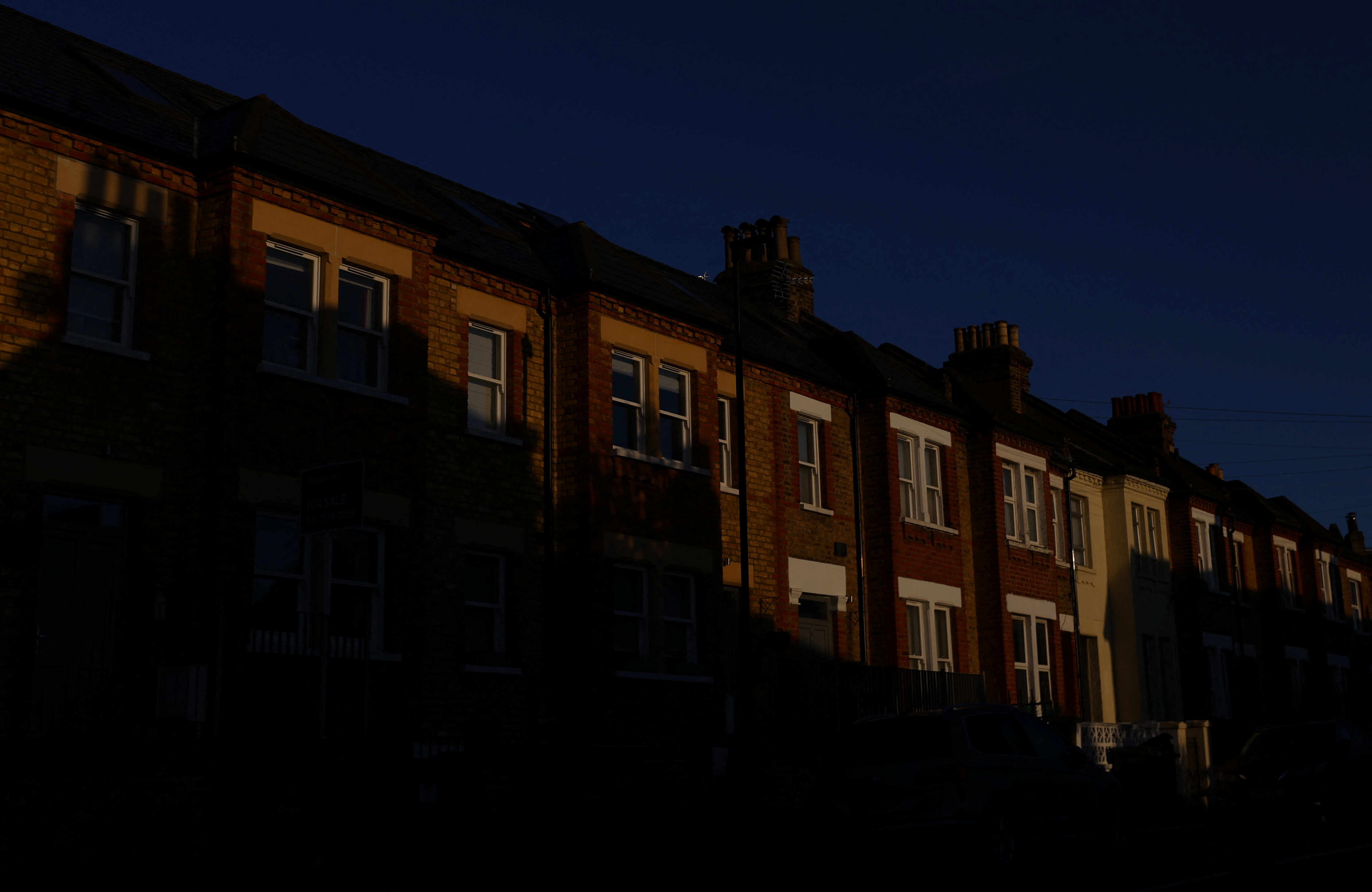 A row of residential houses are seen during sunrise in London