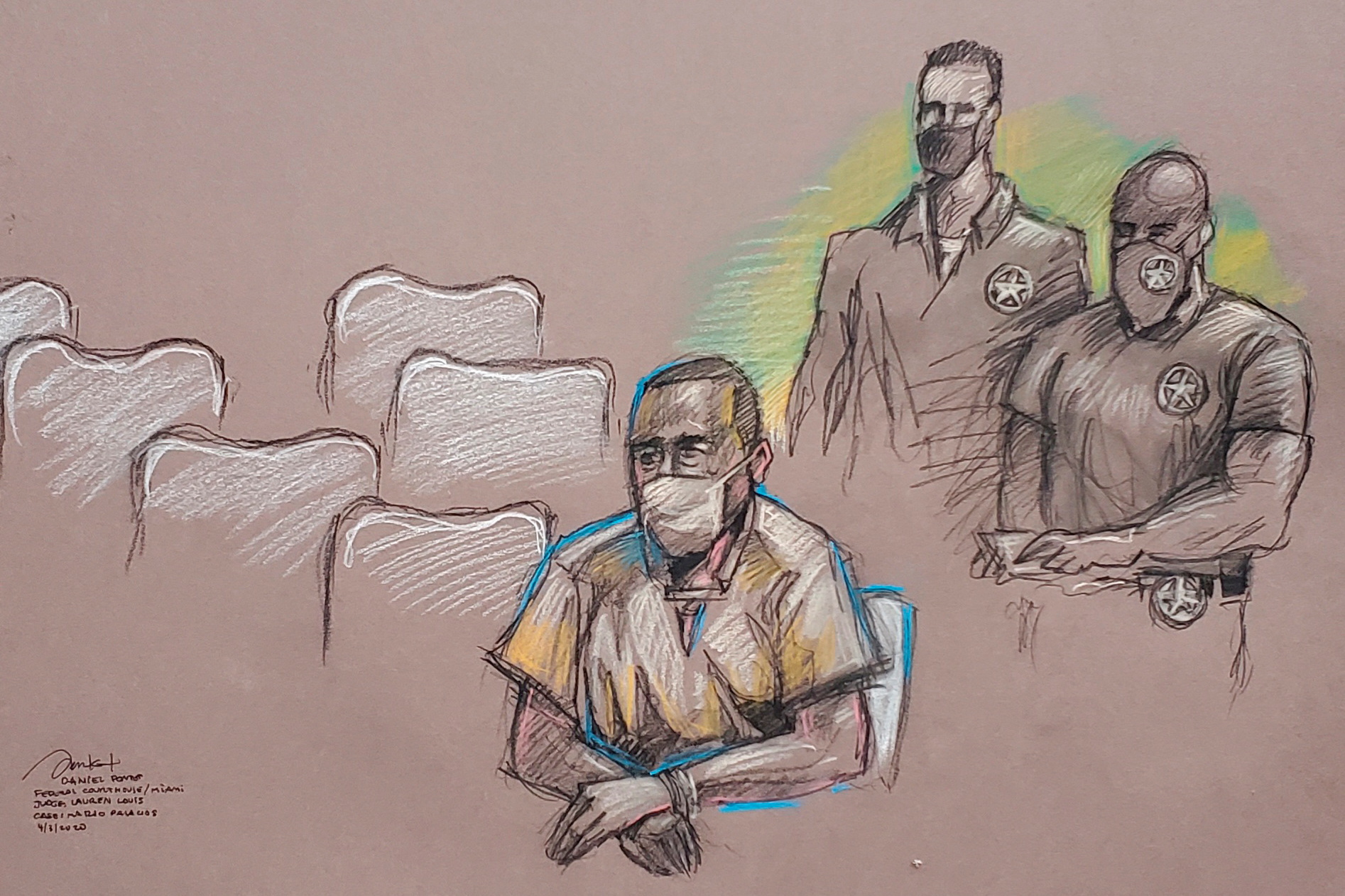 Mario Antonio Palacios  sits near U.S. Marshals during his arraignment at a federal court in Miami