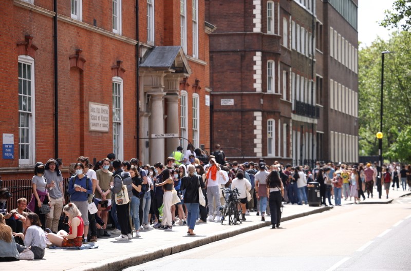 People queue outside a vaccination centre for young people and students at the Hunter Street Health Centre, amid the coronavirus disease (COVID-19) outbreak, in London, Britain, June 5, 2021. REUTERS/Henry Nicholls