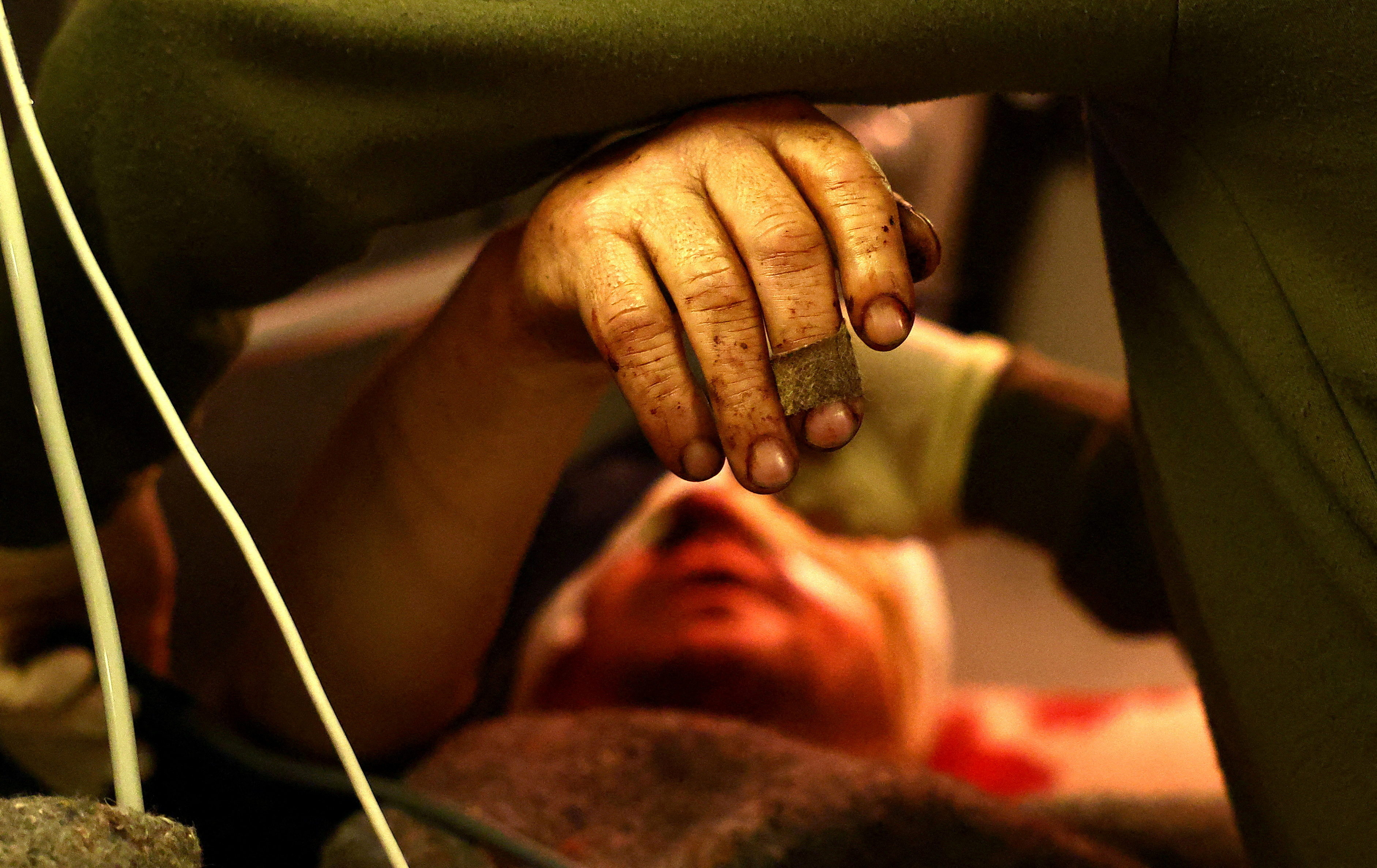 Volunteers with Hospitallers support Ukrainian servicemen during a medical ...