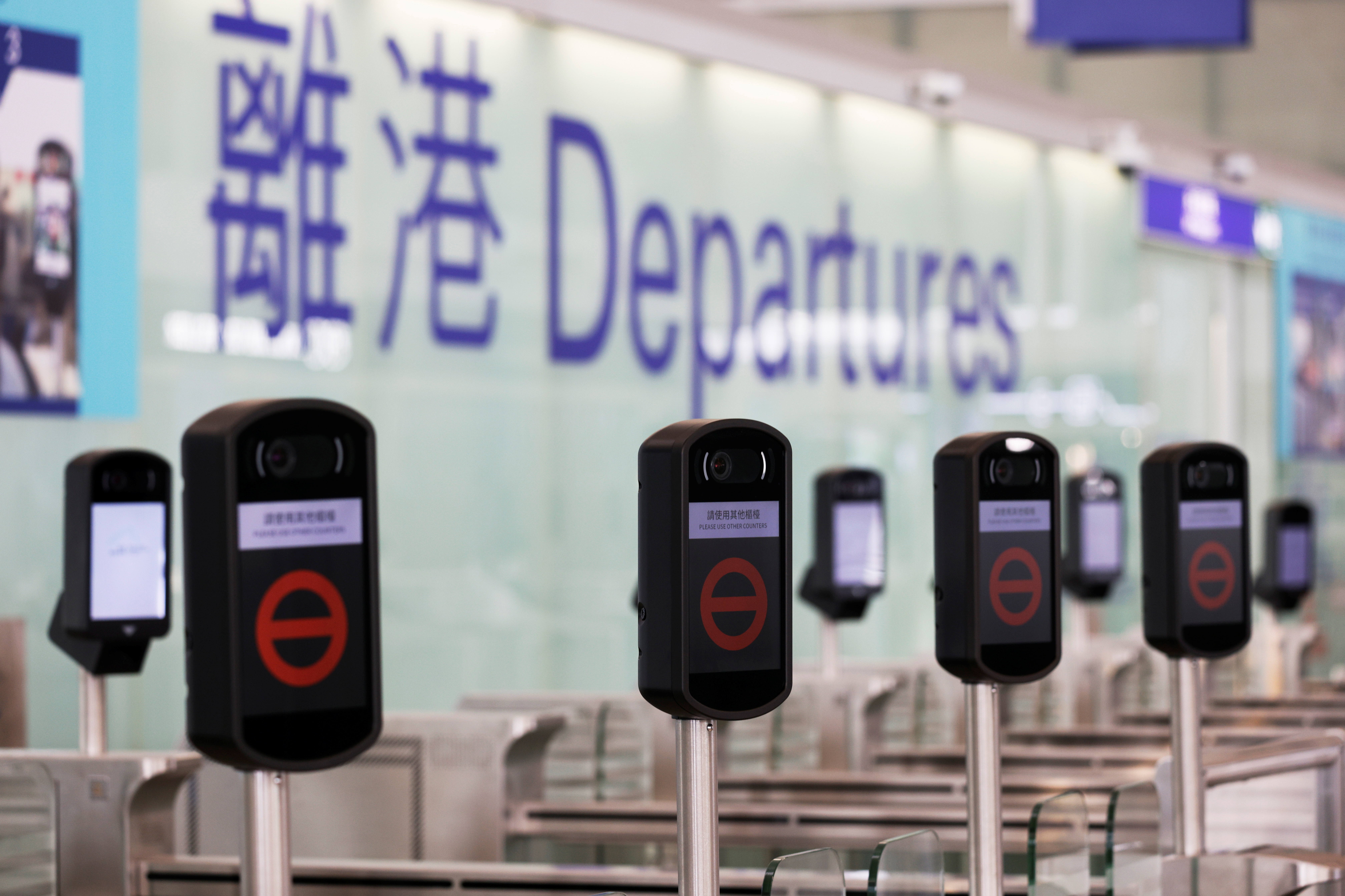 Closed counters are seen at the departures hall of Hong Kong International Airport, following the coronavirus disease (COVID-19) outbreak, in Hong Kong, China February 2, 2021. REUTERS/Tyrone Siu