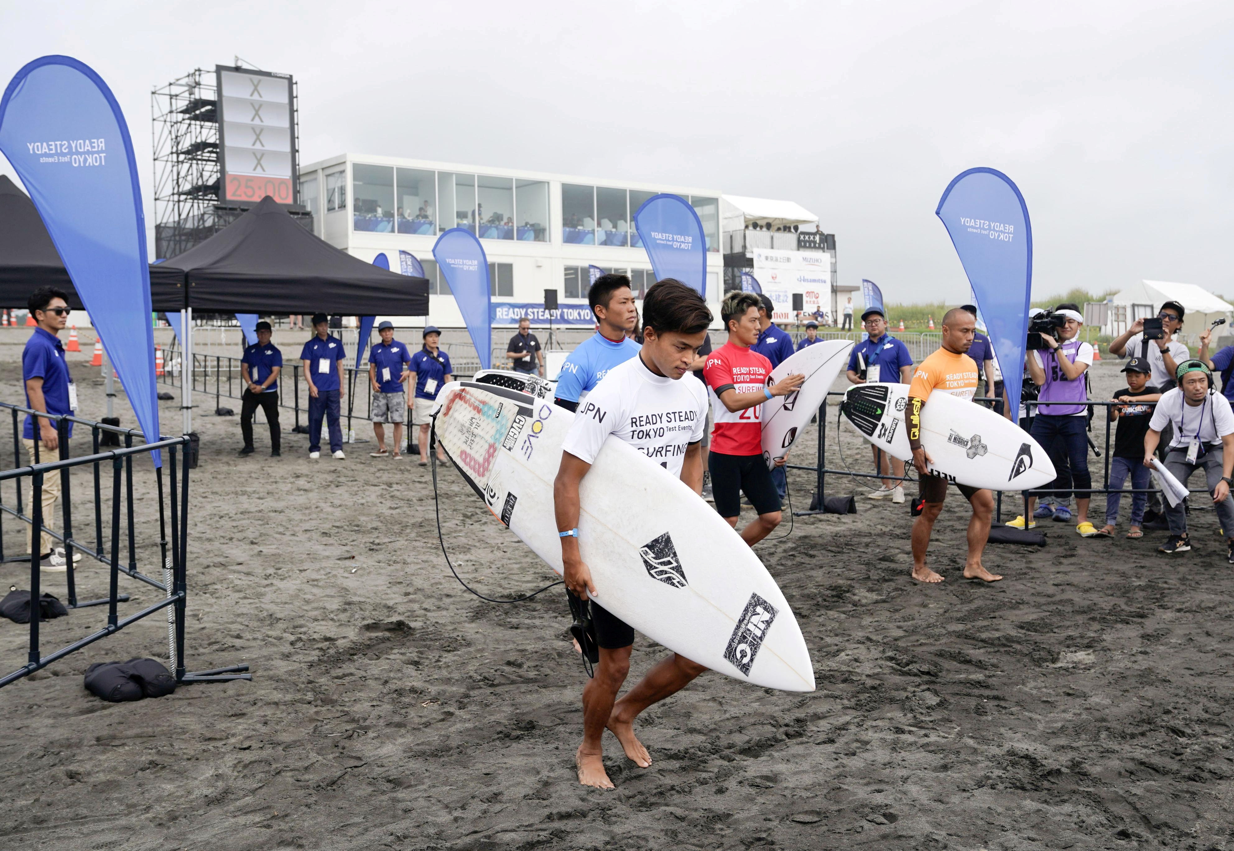 Competitors are seen during a Tokyo 2020 Olympics surfing test event at at Tsurigasaki-kaigan beach, also known as Shidashita beach in Ichinomiya Town, Japan