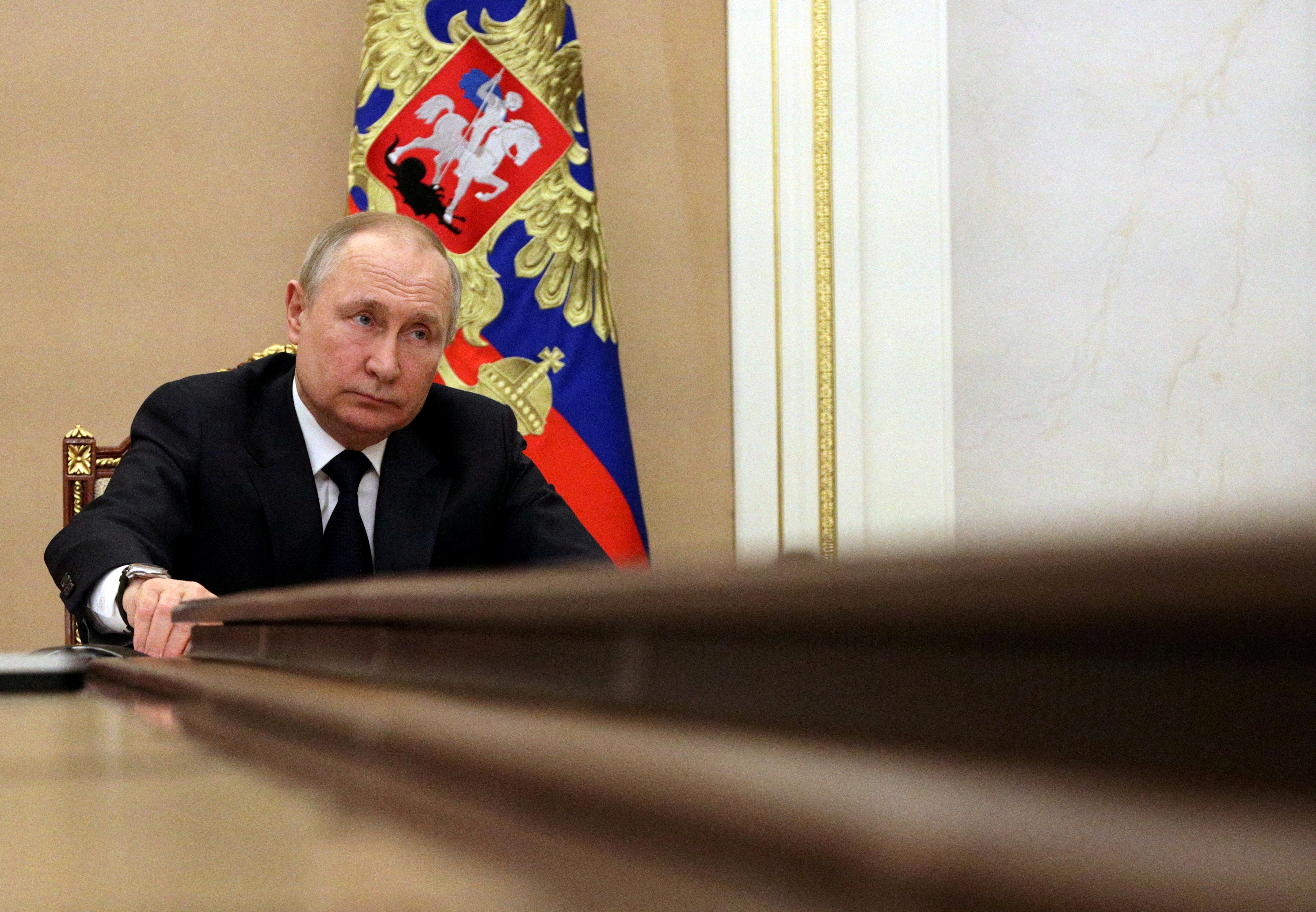 Russian President Vladimir Putin attends a meeting with government members via a video link in Moscow