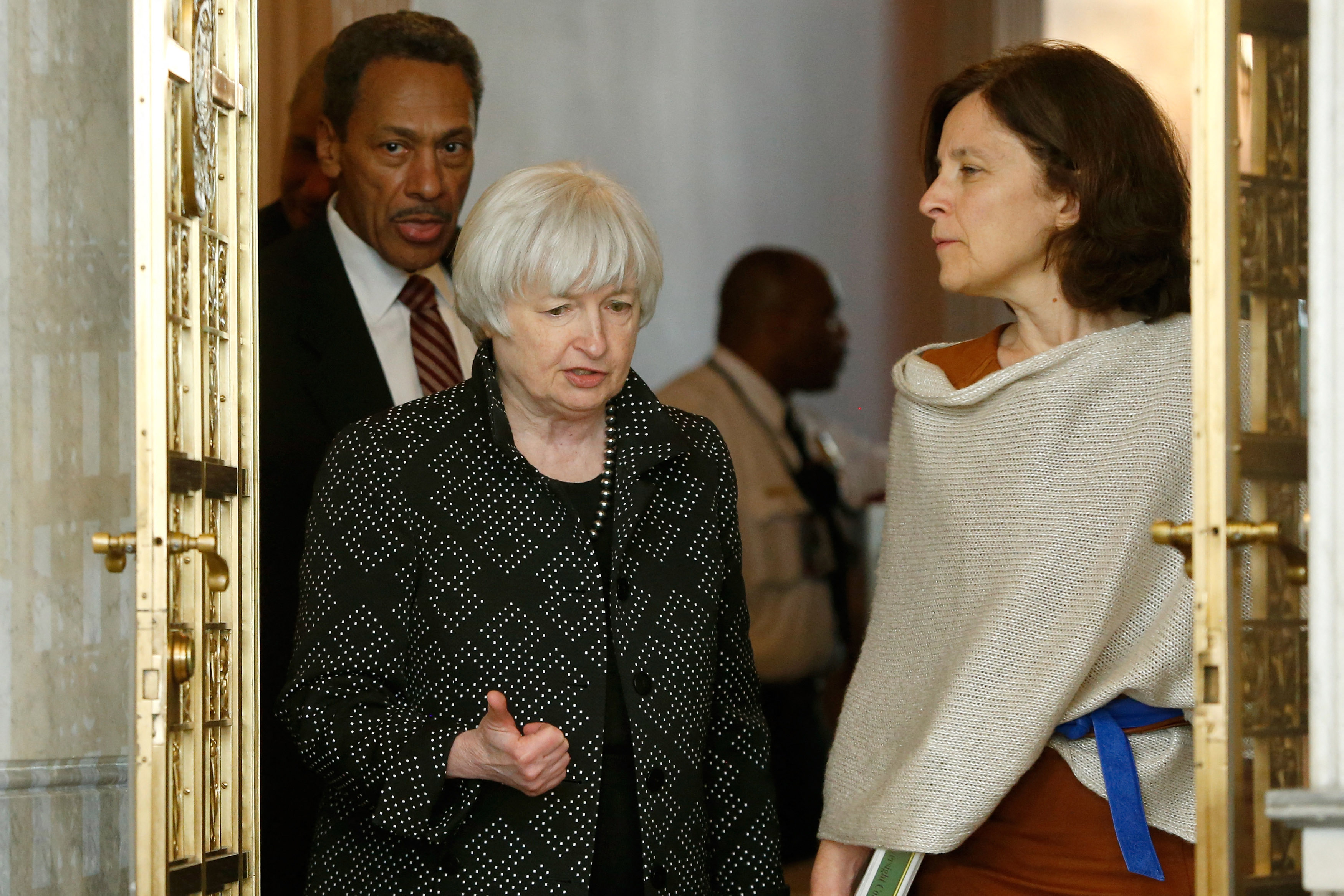 U.S. Federal Reserve Chair Janet Yellen (2nd L) and Deputy Secretary of the U.S. Treasury Sarah Bloom Raskin (R) arrive for a meeting of the Financial Stability Oversight Council at the Treasury Department in Washington October 6, 2014.  REUTERS/Jonathan Ernst/File Photo