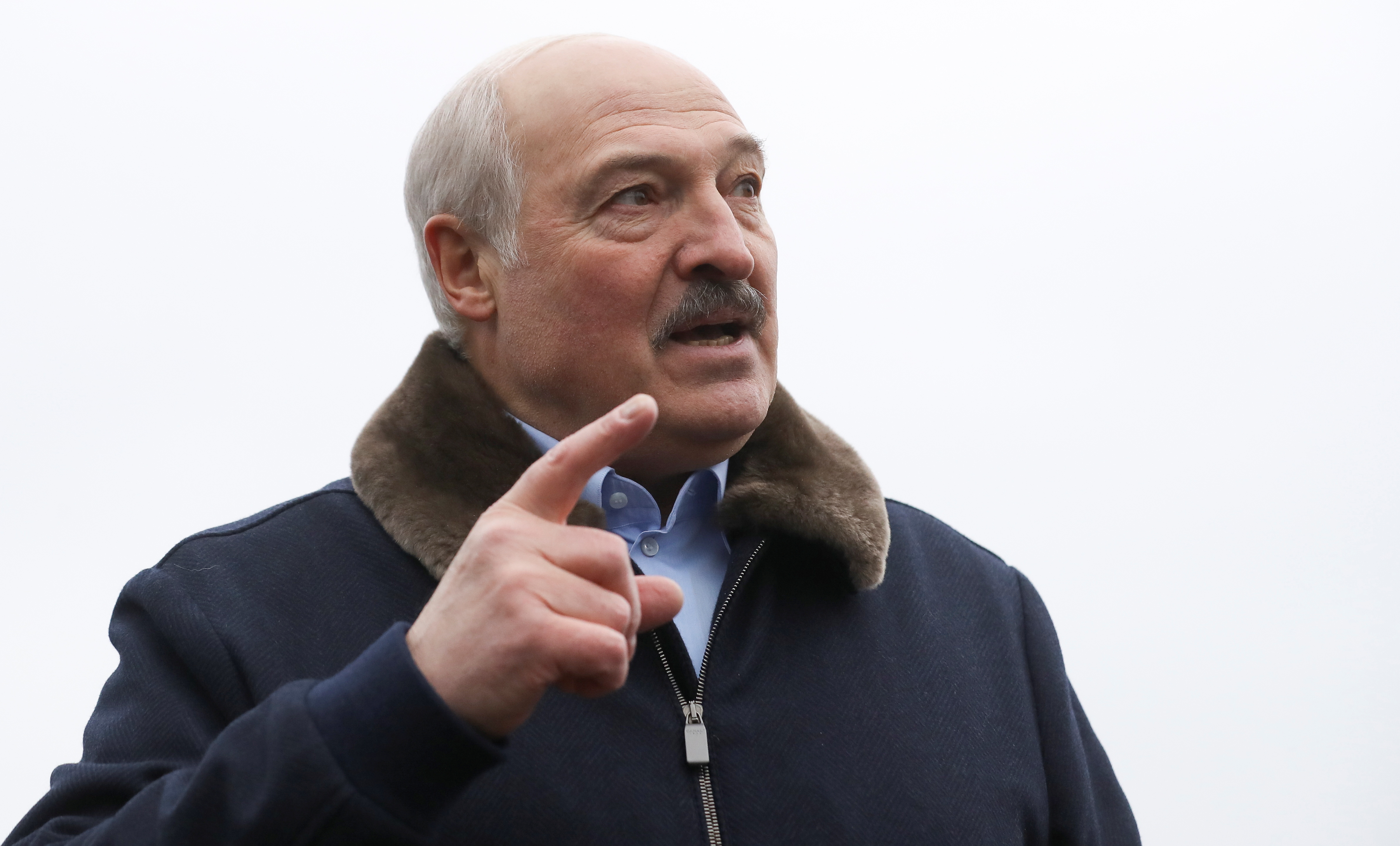 Belarusian President Alexander Lukashenko speaks to migrants as he visits the transport and logistics centre Bruzgi on the Belarusian-Polish border, in the Grodno region, Belarus November 26, 2021. REUTERS/Kacper Pempel