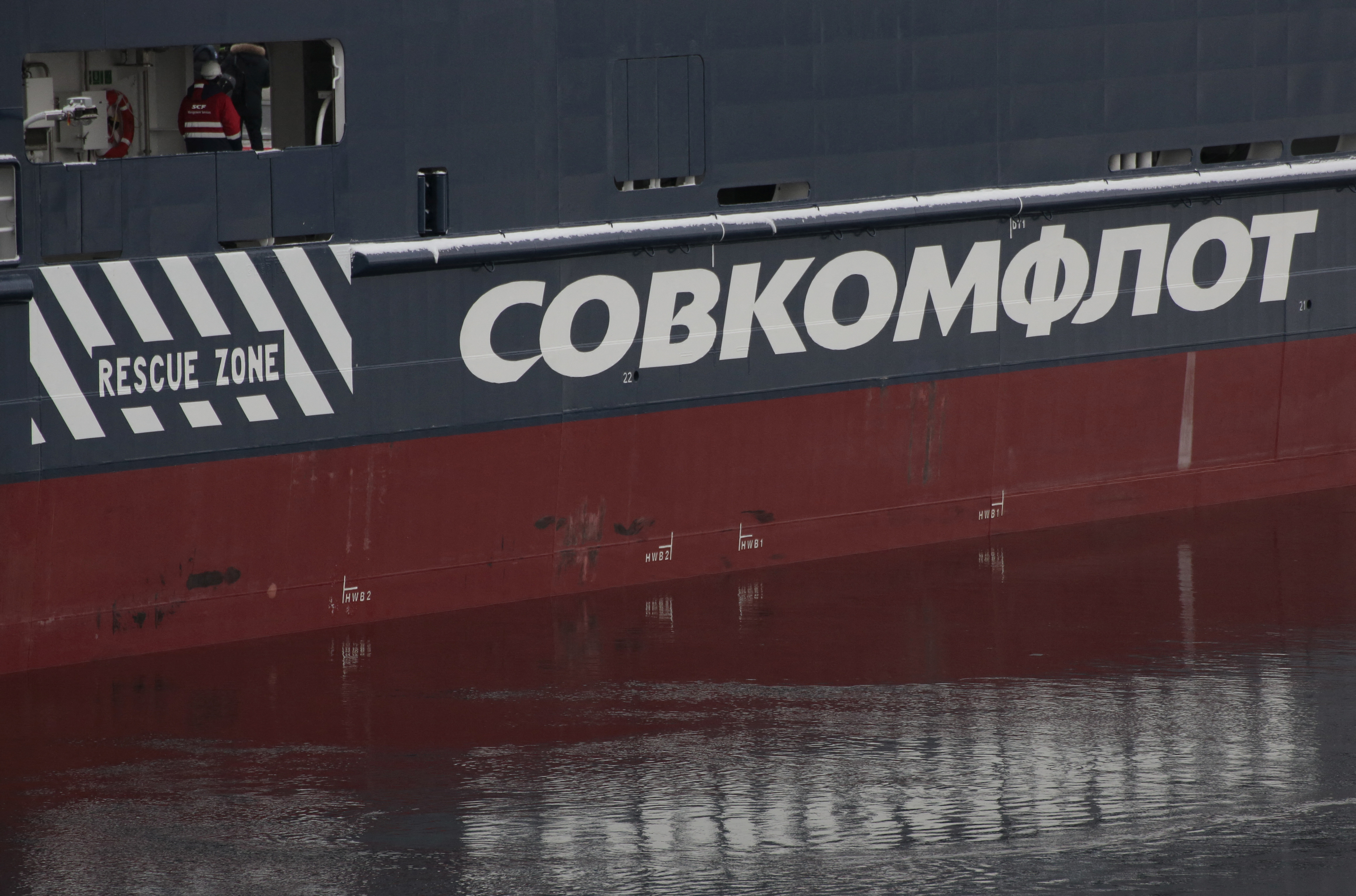 The logo of Russian state shipping company Sovcomflot is seen on the multifunctional icebreaking standby vessel 