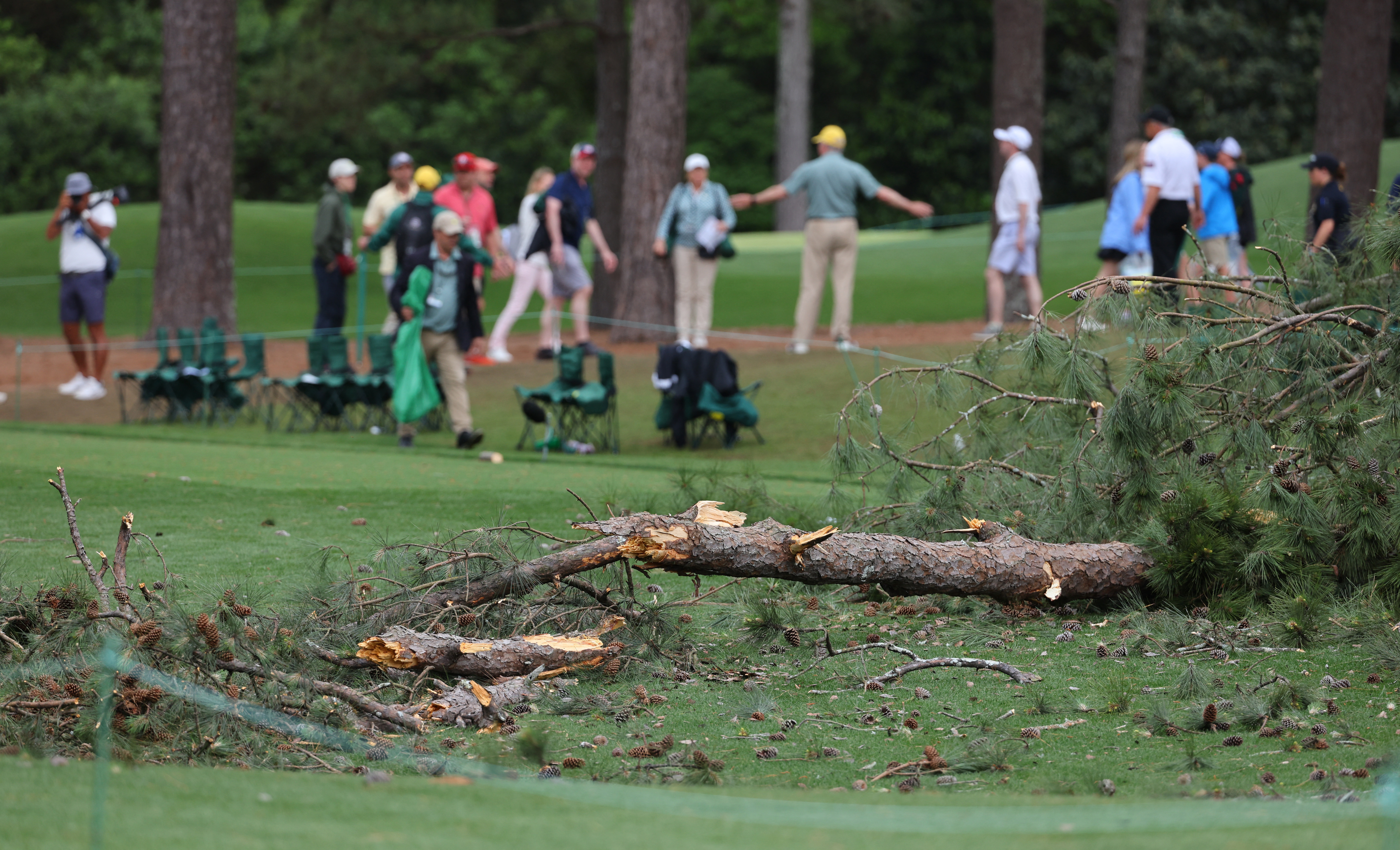 Masters second round suspended for day after strong storms down trees