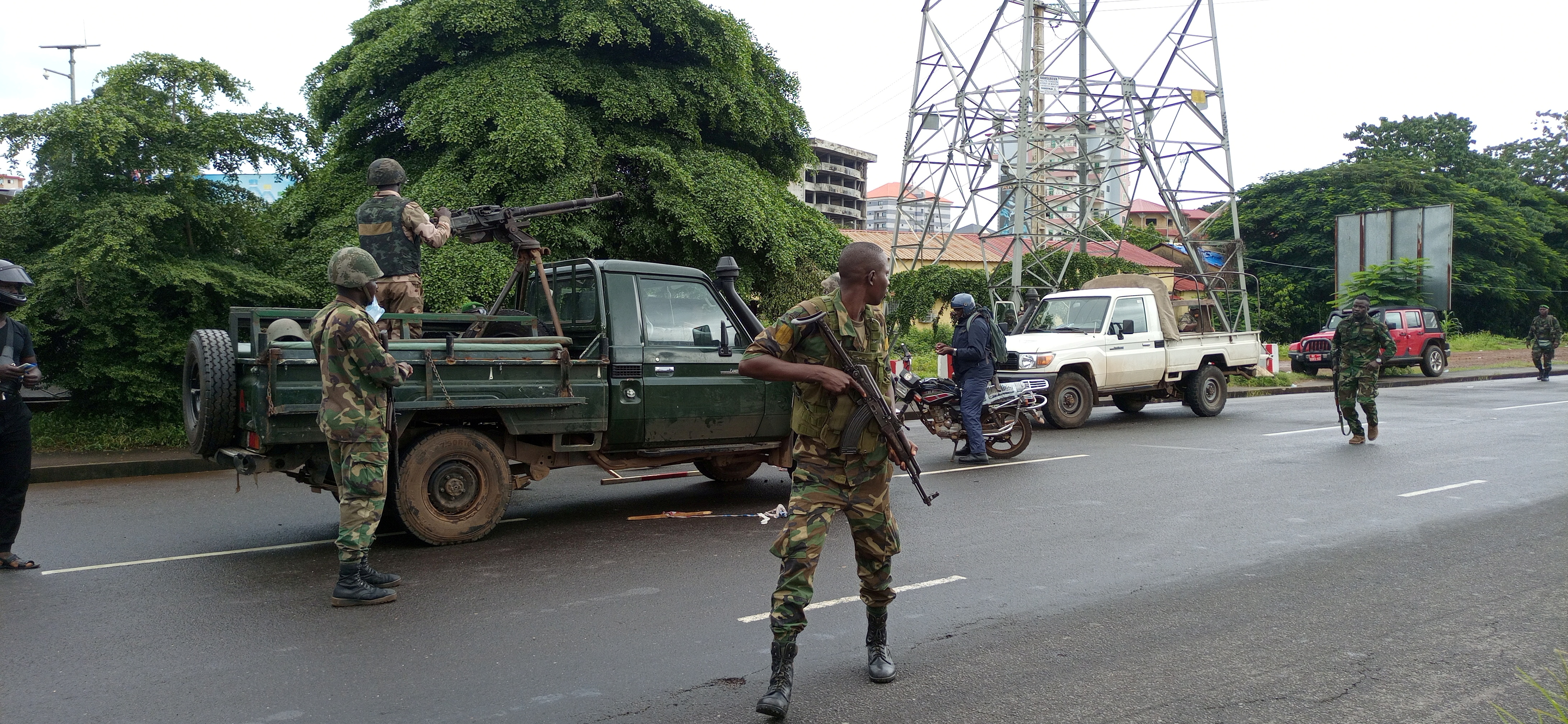 Army soldiers hold a checkpoint after the uprising that led to the toppling of President Alpha Conde in Kaloum neighbourhood of Conacry