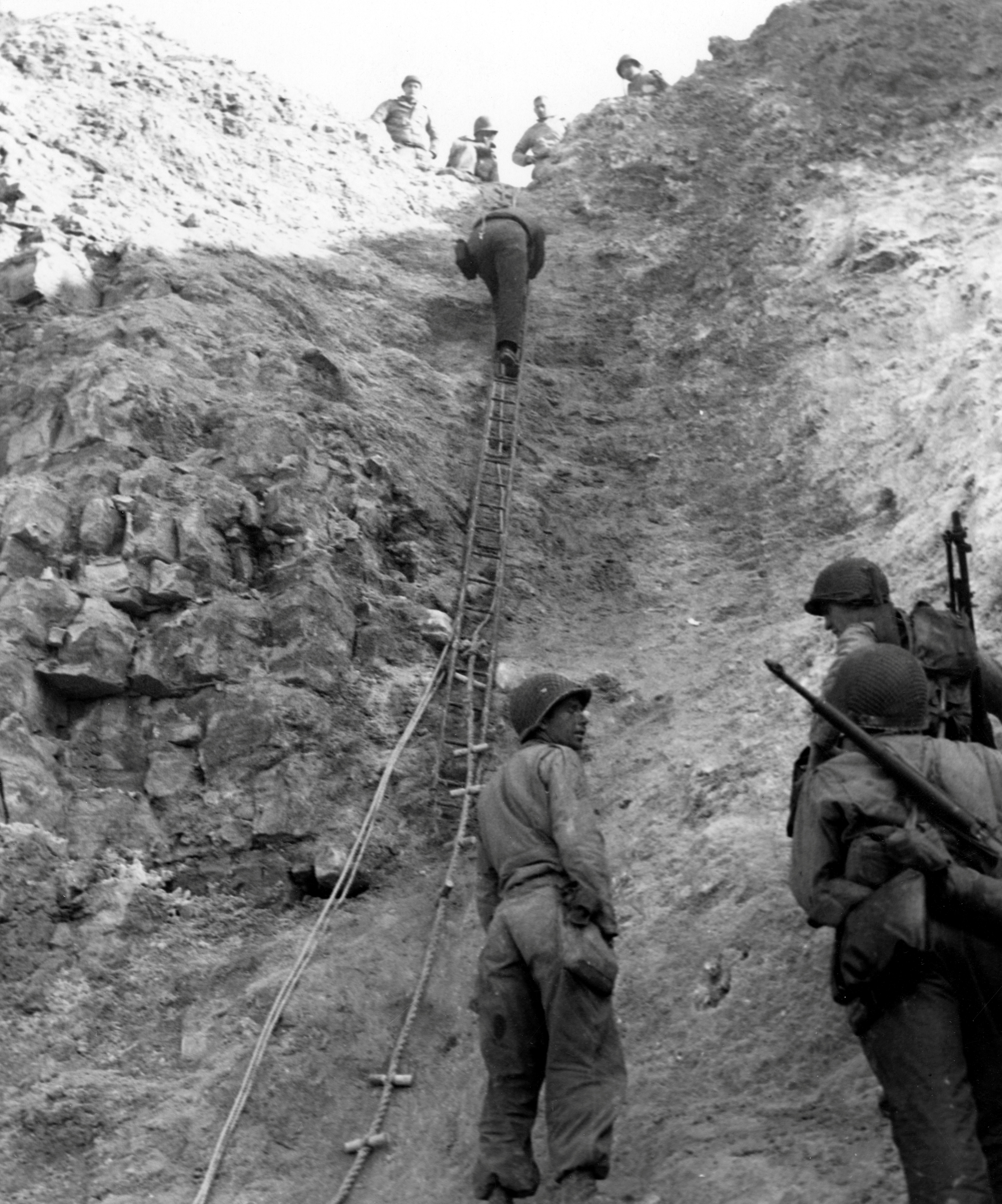 U.S. Army Rangers show off the ladders they used to storm the cliffs which they assaulted in support of Omaha Beach landings on D-Day in Pointe du Hoc