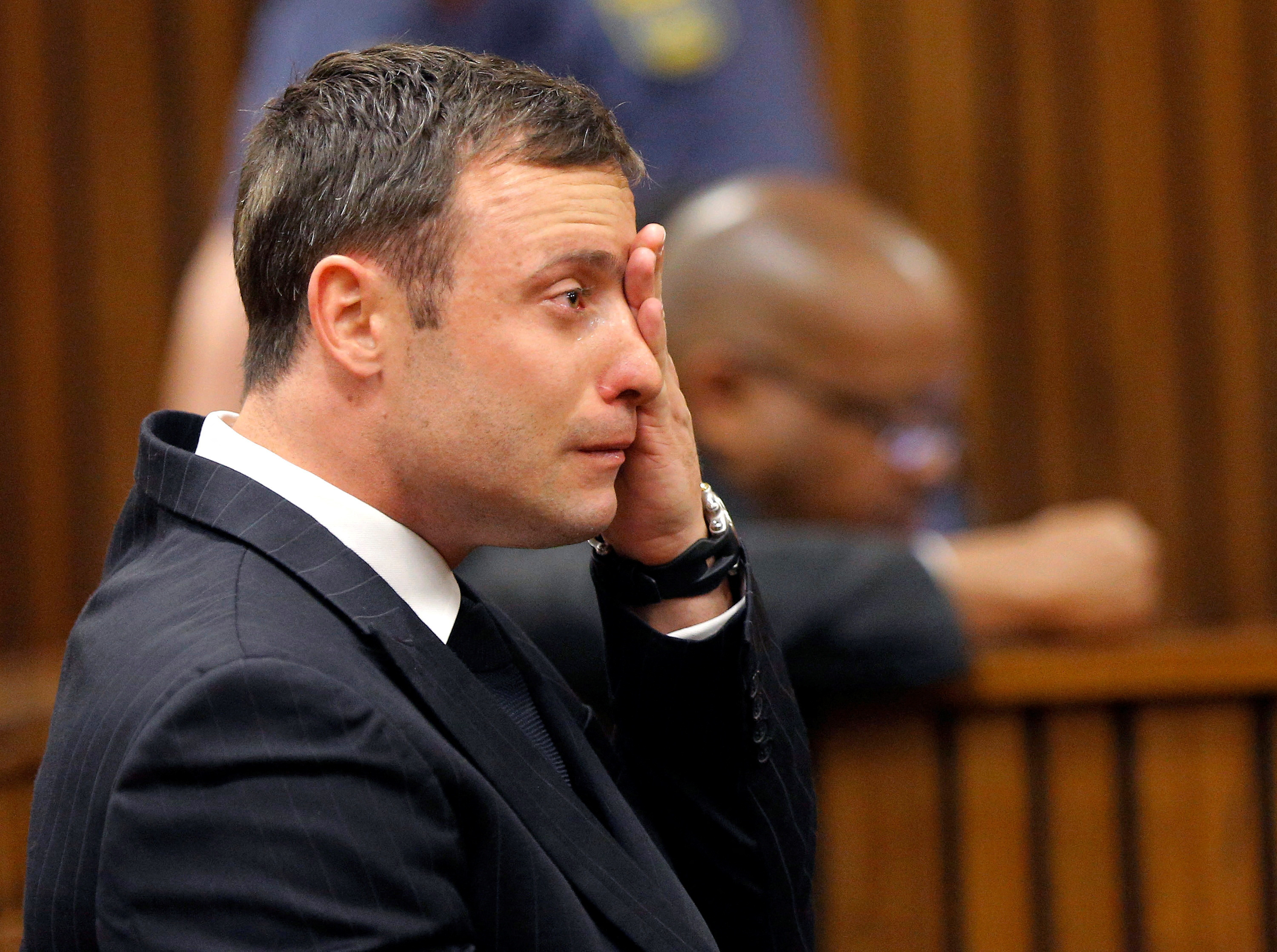 Olympic and Paralympic track star Pistorius reacts as he listens to Judge Masipa's judgement at the North Gauteng High Court in Pretoria