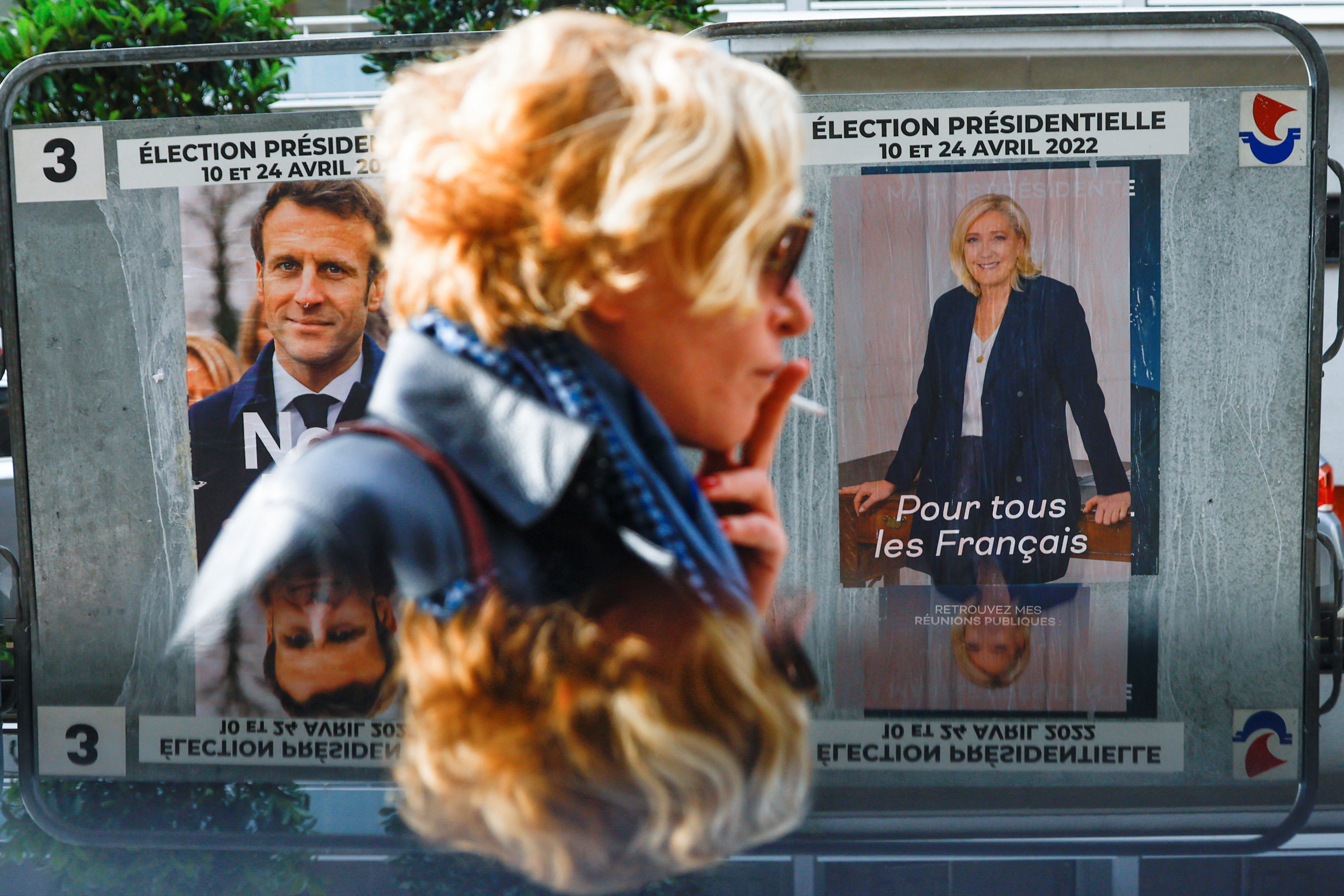 Official campaign posters of French presidential election candidates Marine le Pen and Emmanuel Macron, in Paris