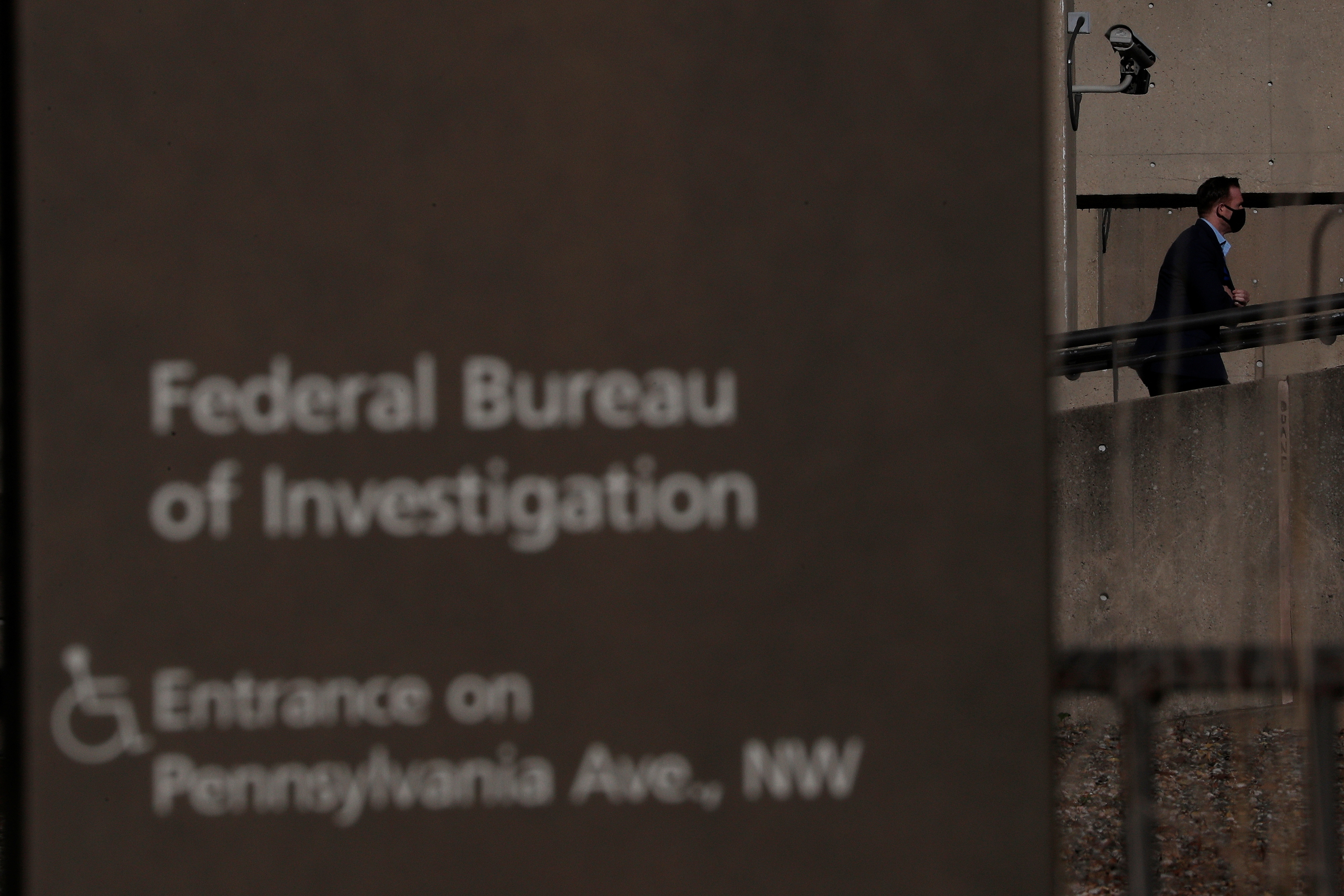 A pedestrian walks past the J. Edgar Hoover FBI Building in Washington