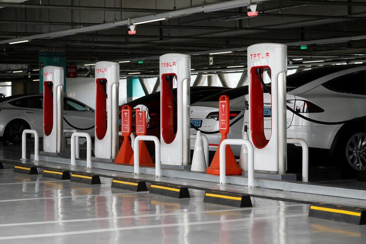 Tesla electric vehicles are charged at a Tesla Supercharger charging station in Hanam