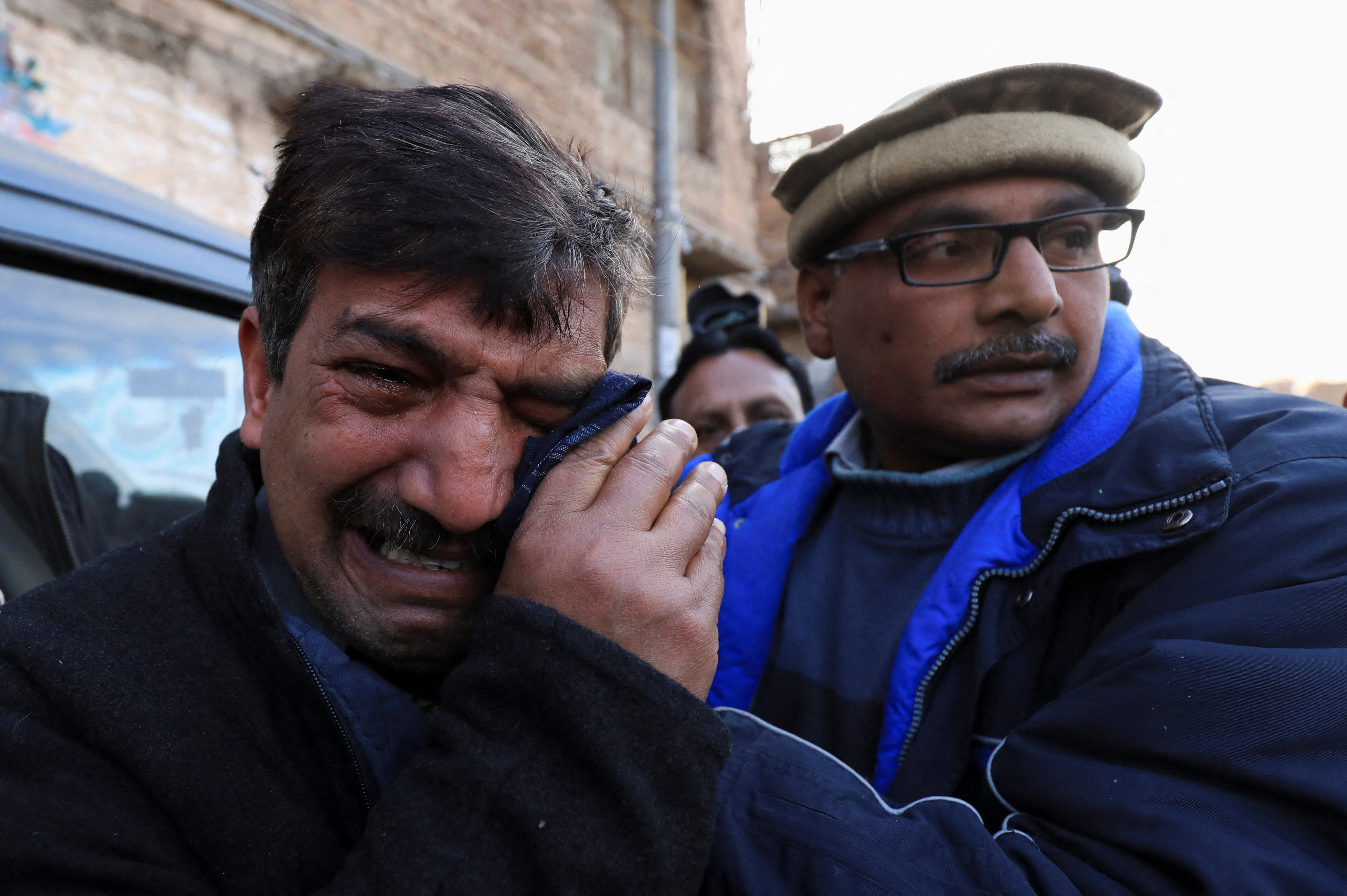 Relative mourns the death of priest William Siraj, who was killed by unknown armed men in Peshawar