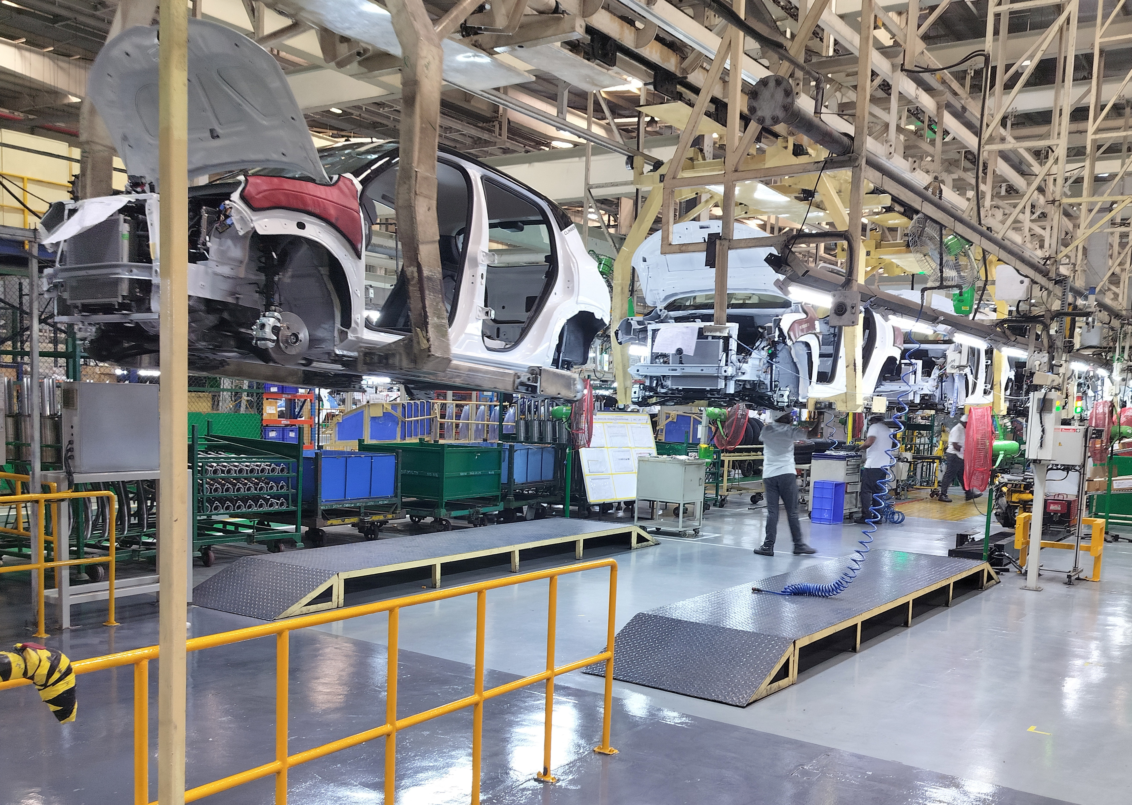 Employees work at the manufacturing plant of Renault Nissan Automotive India in Oragadam