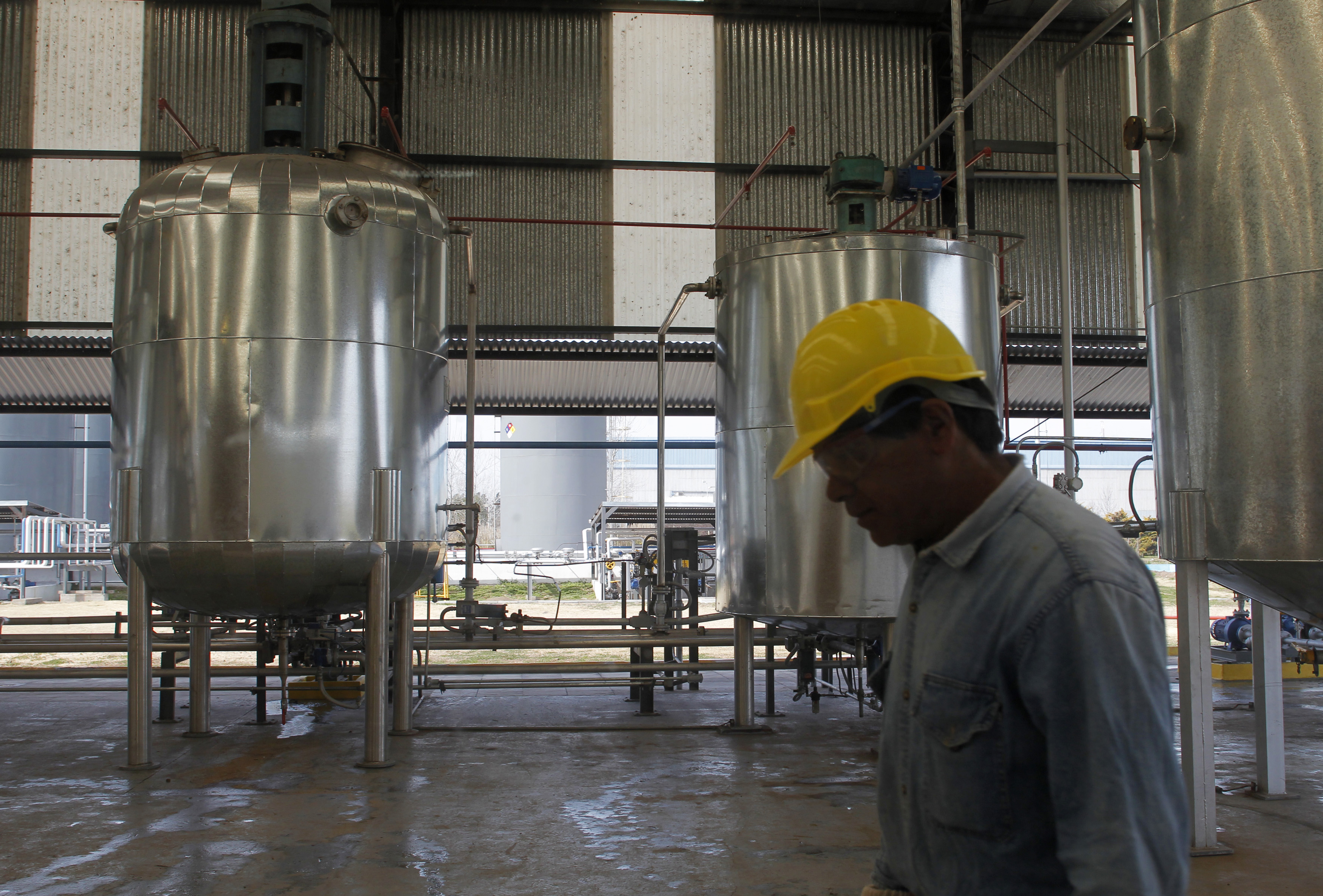 A technician walks by at the newly opened Oilfox S.A. Biofuel factory in San Nicolas