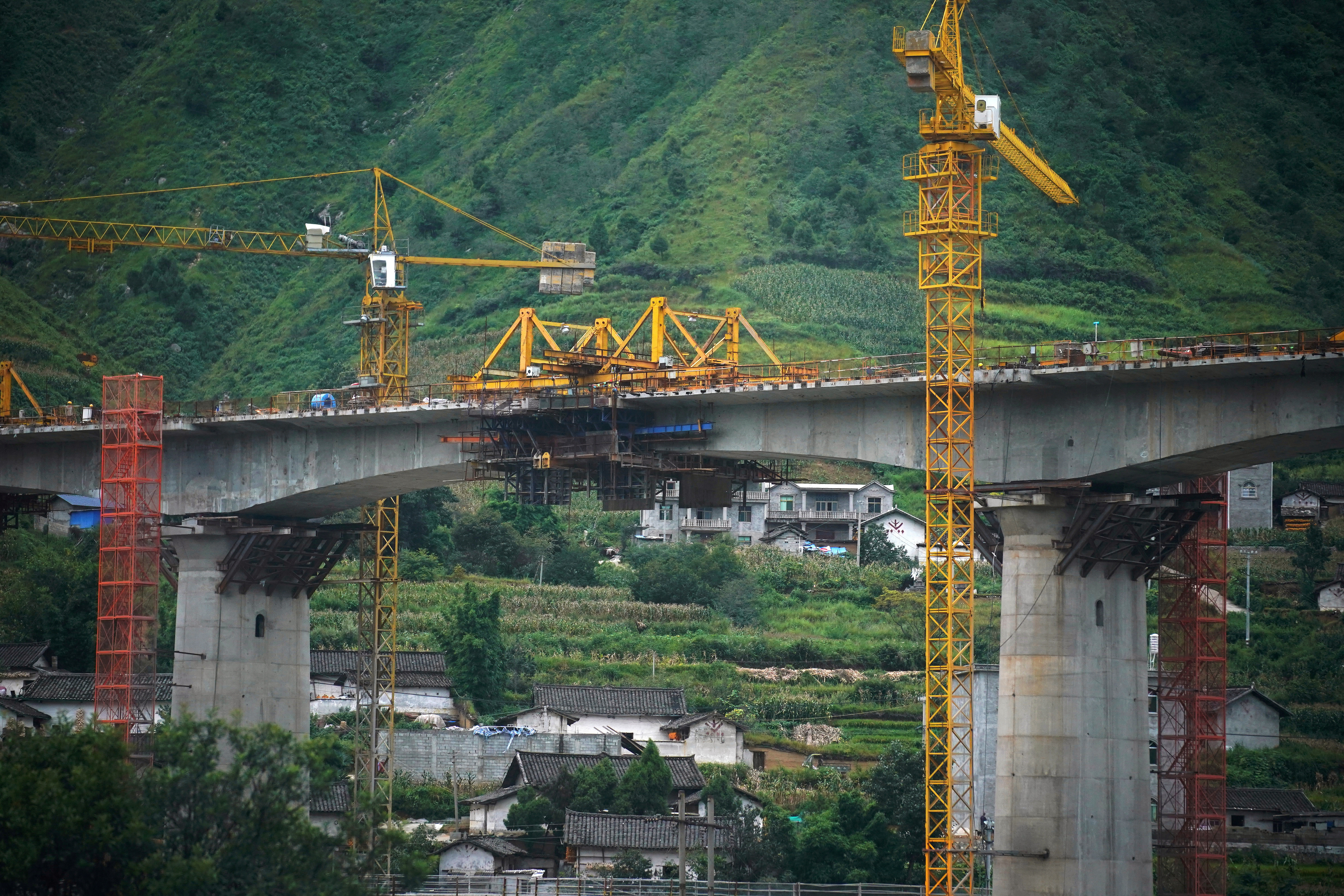 Construction site of a bridge is seen during a government-organised media tour in Liangshan Yi Autonomous Prefecture, Sichuan