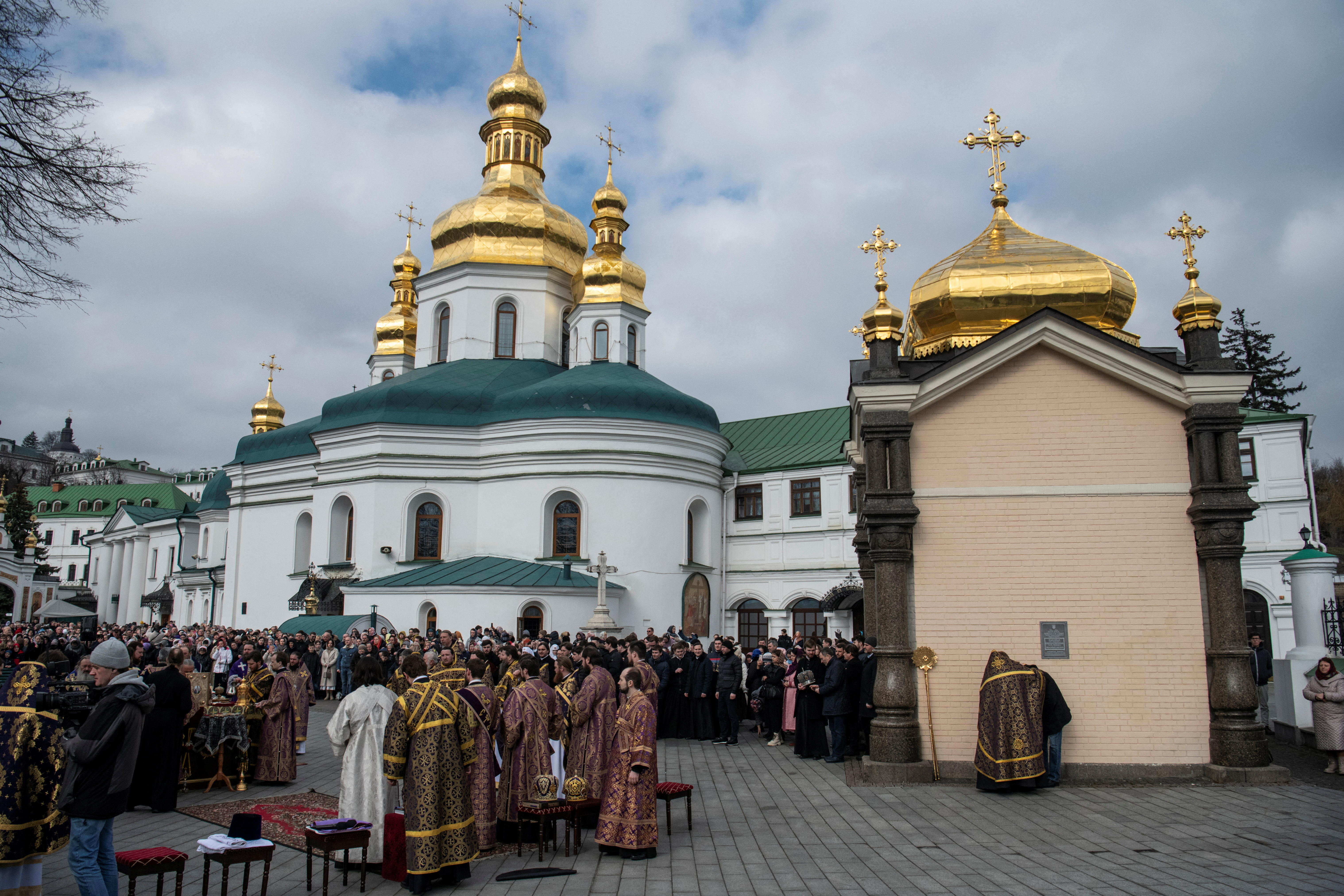 Believers attend a service led by Metropolitan Onufriy, head of the Ukrainian Orthodox Church branch loyal to Moscow, at a compound of the Kyiv Pechersk Lavra monastery in Kyiv