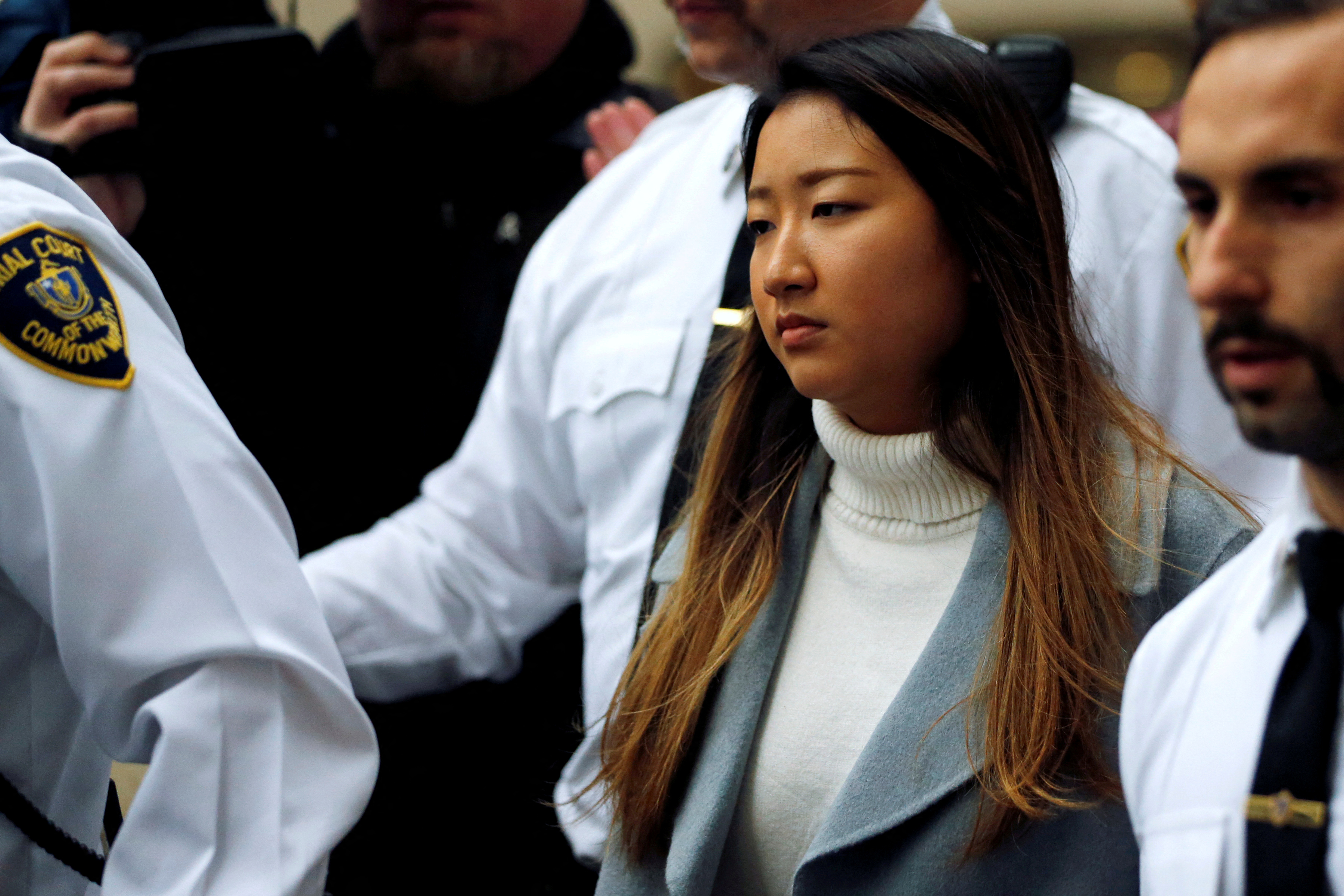Inyoung You, a former Boston College student from South Korea, leaves after being arraigned