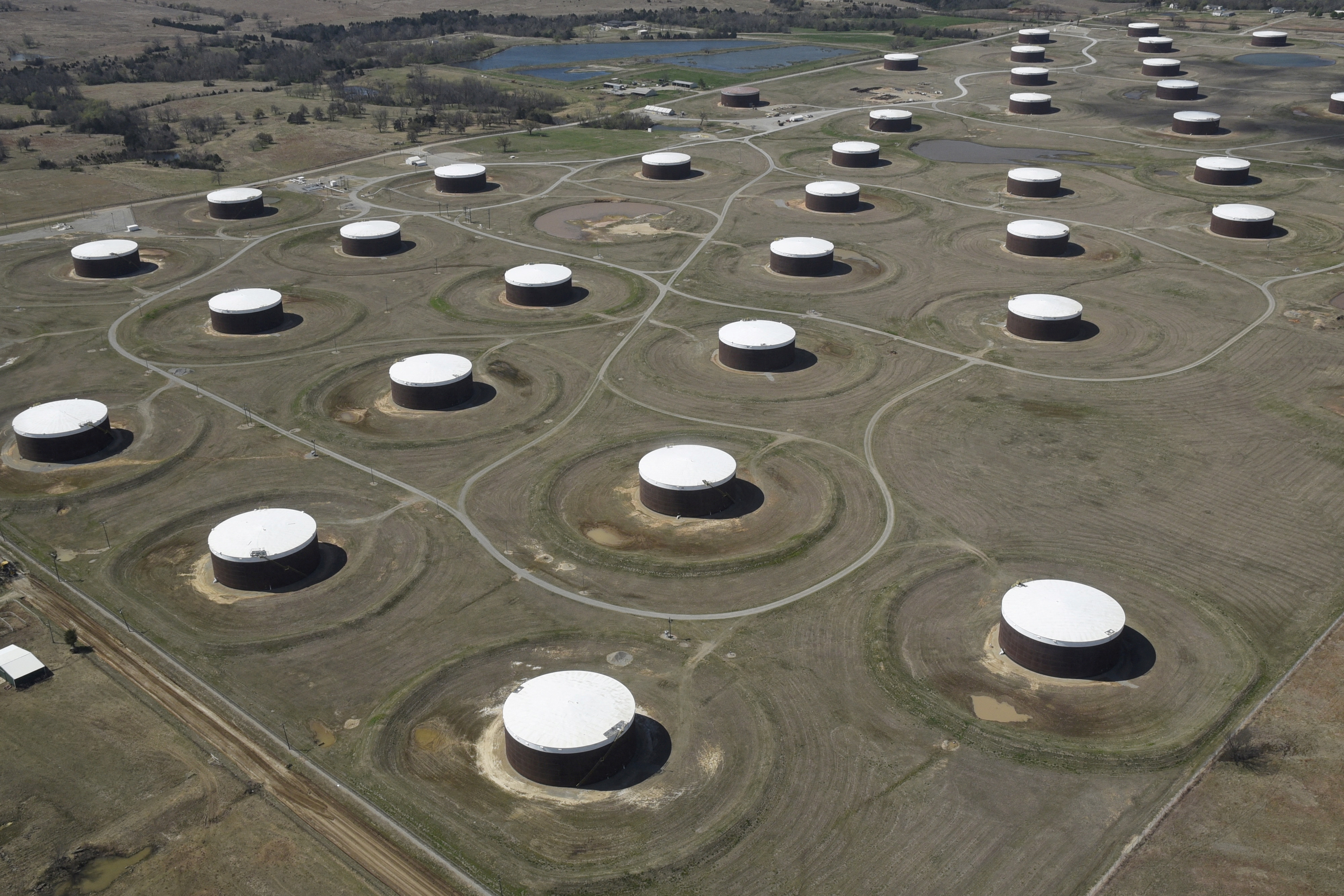 Crude oil storage tanks are seen from above at the Cushing oil hub, in Cushing, Oklahoma, March 24, 2016. Picture taken March 24, 2016. REUTERS/Nick Oxford//File Photo