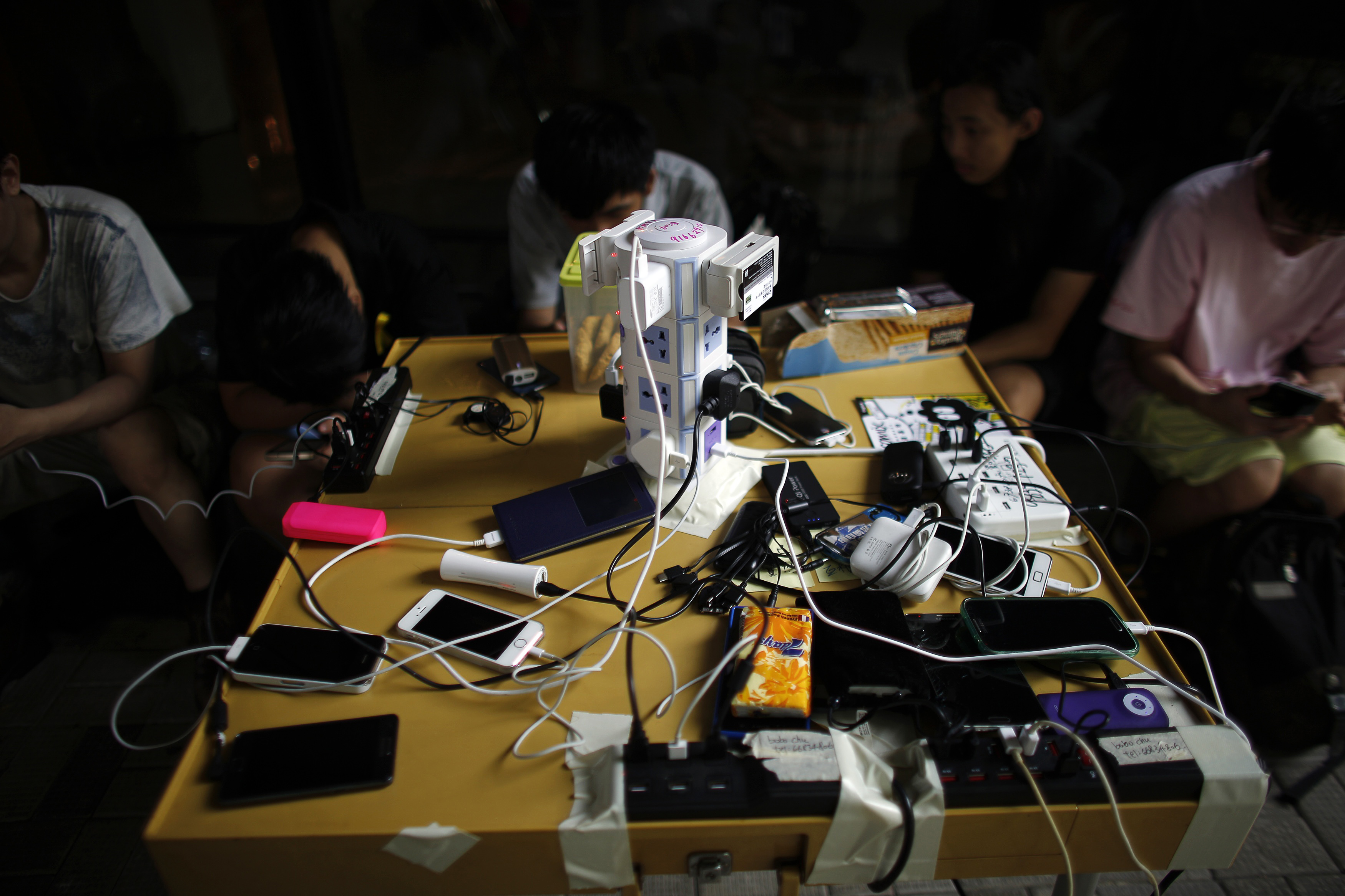 Mobile phone chargers are seen in an area blocked by pro-democracy protesters near the government headquarters in Hong Kong