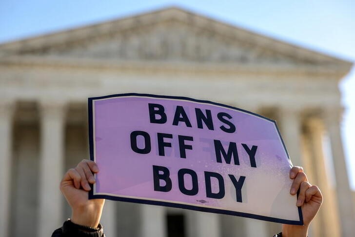 Protestors demonstrate outside U.S. Supreme Court as the court weighs Texas abortion law, in Washington