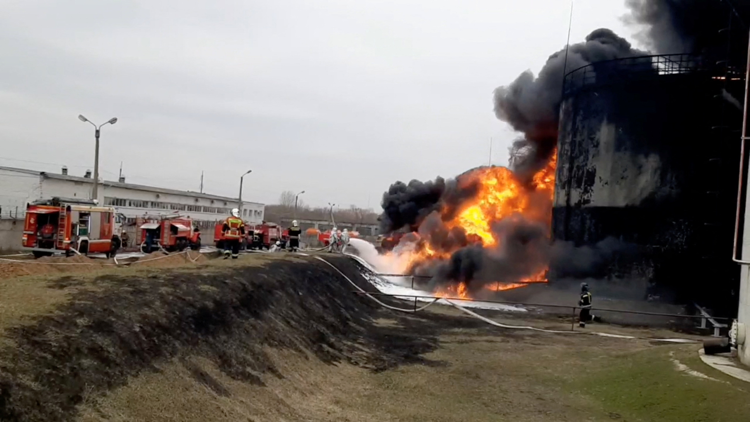 A still image shows a fuel depot on fire in Belgorod