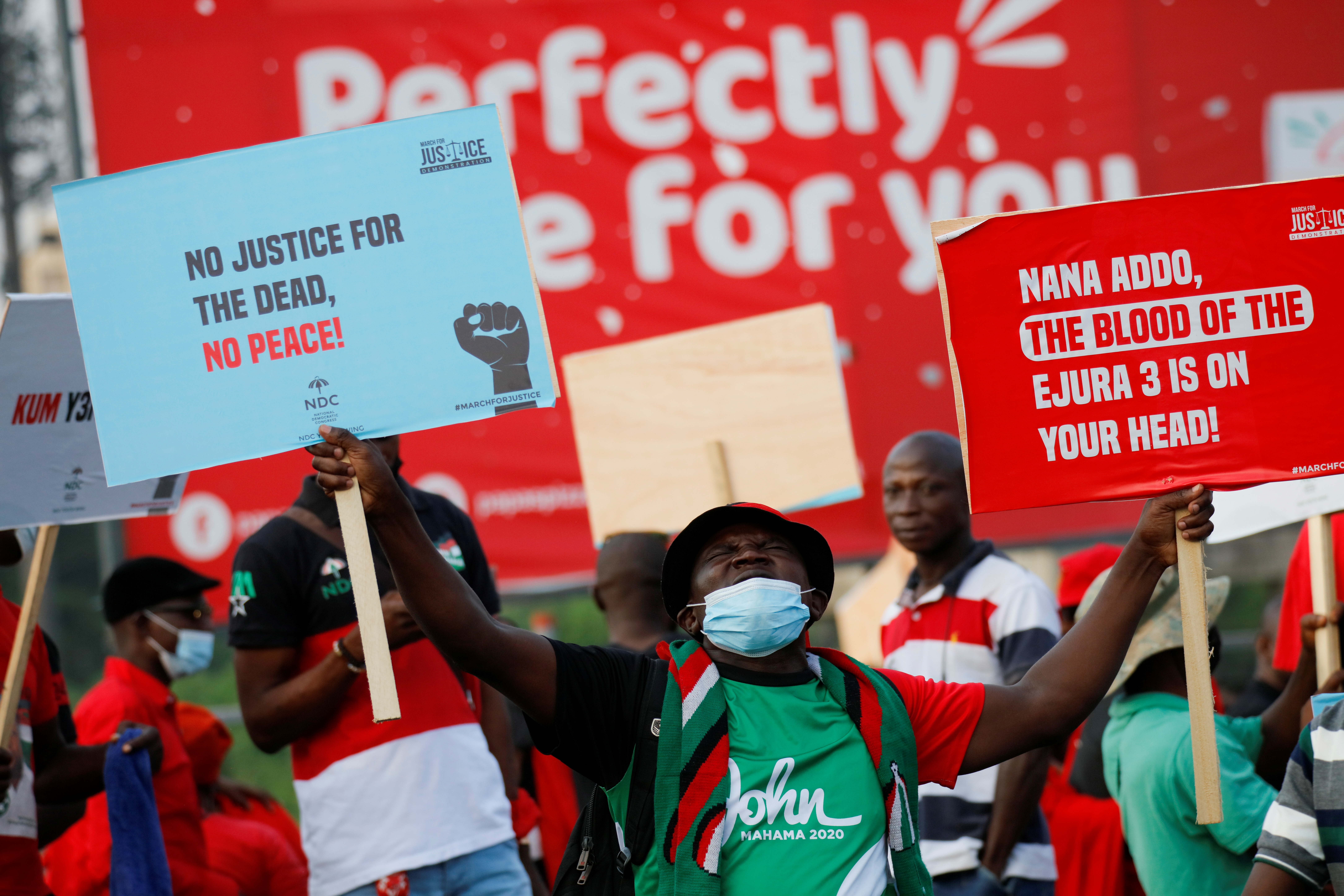Supporters of Ghana's National Democratic Congress (NDC) party attend a protest, in Accra