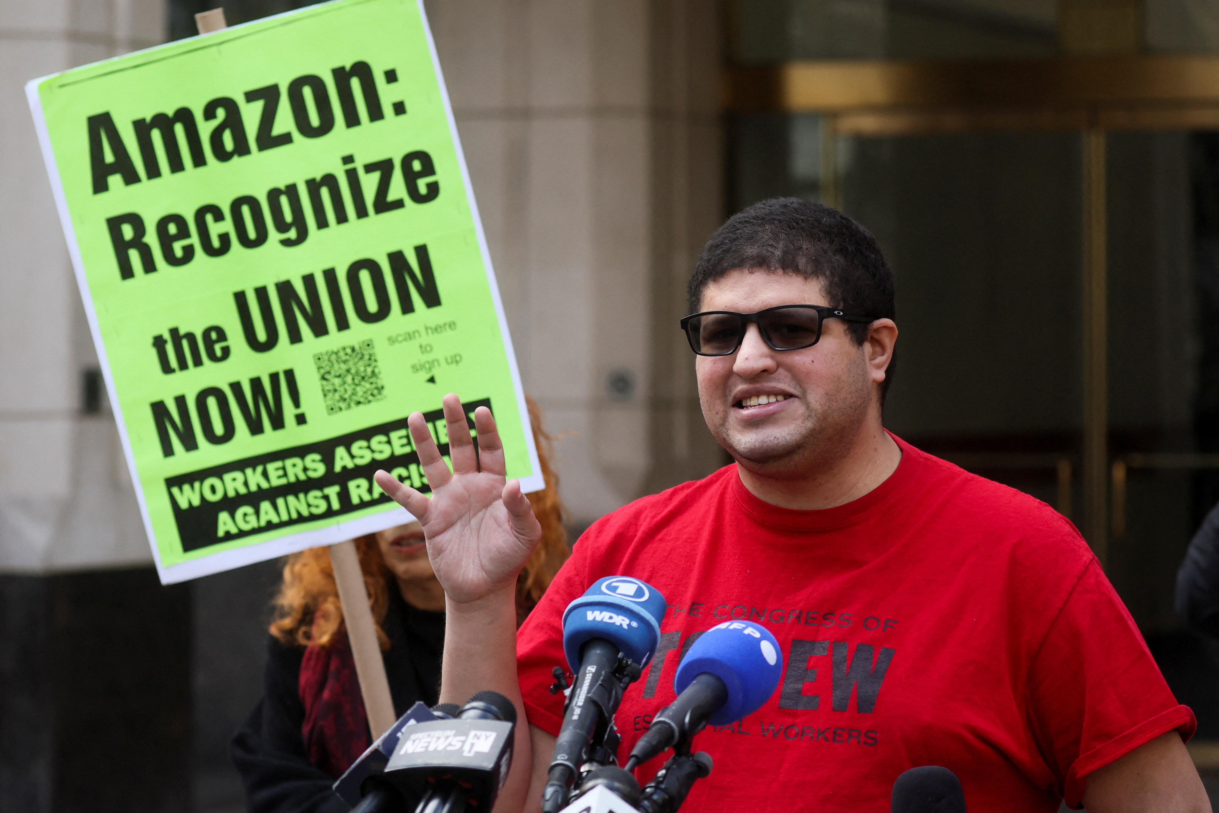 Amazon.com Inc workers react to the outcome of the vote to unionize, in Brooklyn