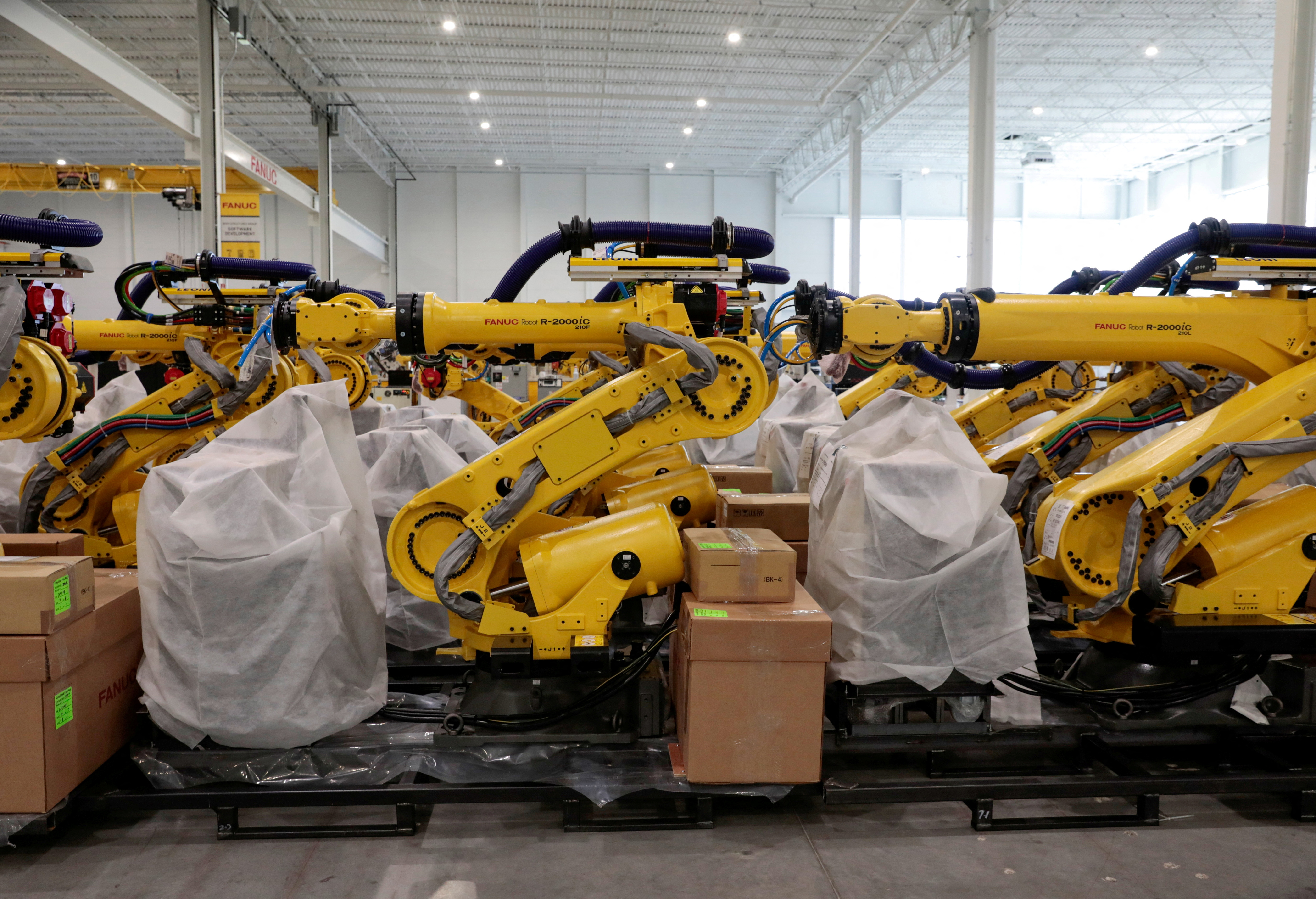 An inventory of manufacturing robots, waiting to be shipped to customers, are seen in a FANUC American facility