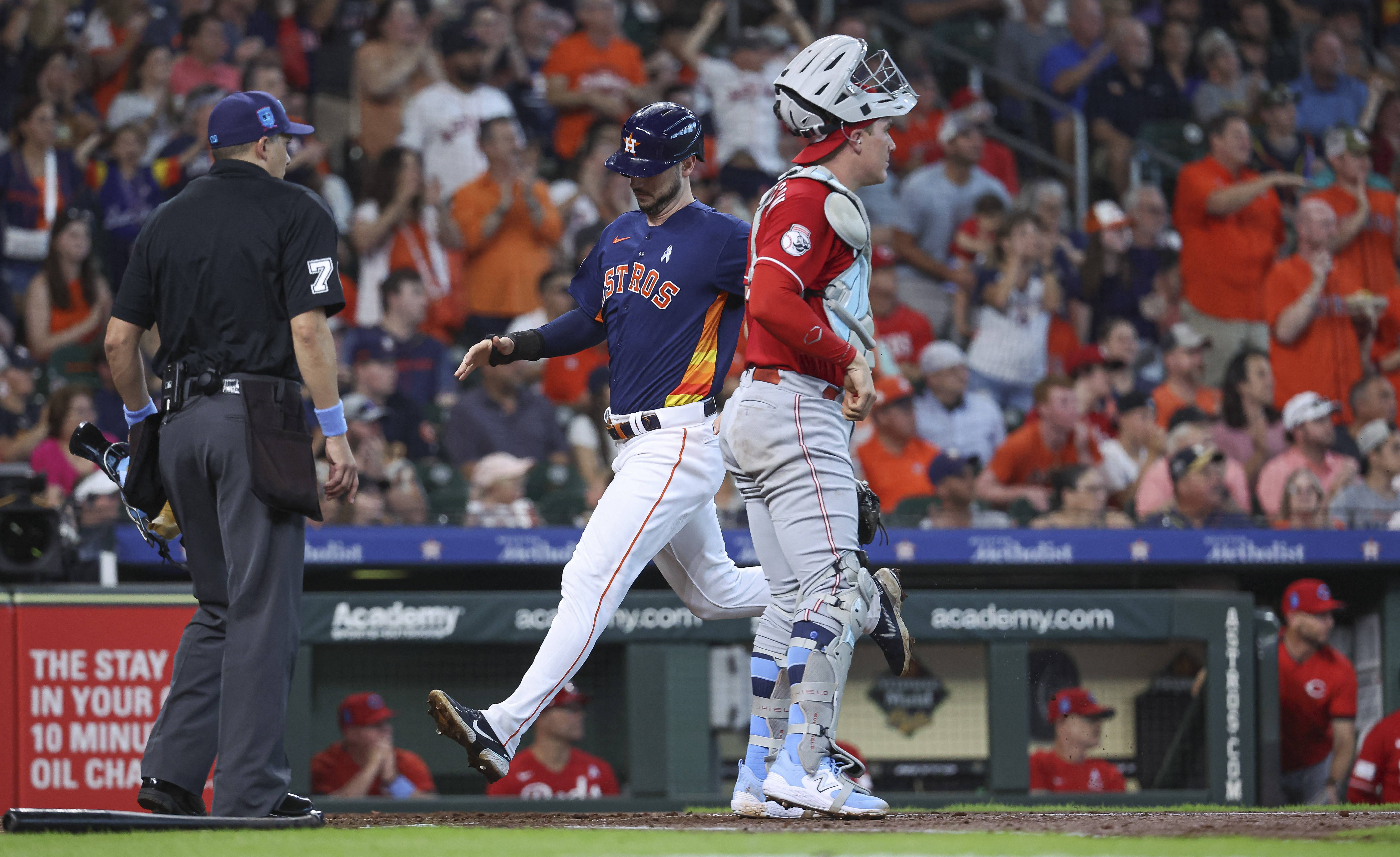 Reds score 3 in 10th to get 9-7 win over Astros, extend winning